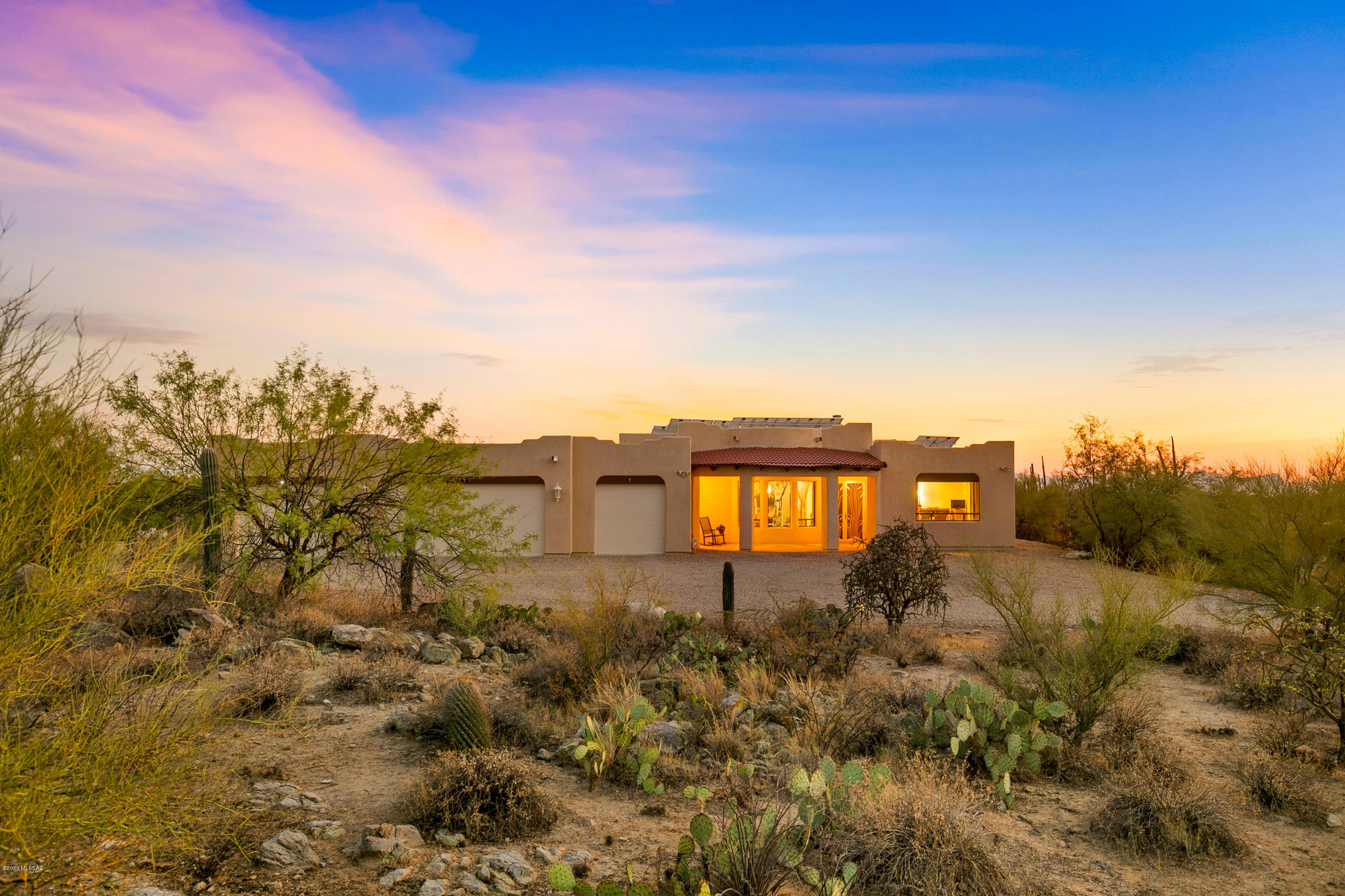 This gorgeous custom home sits on 5 acres with breathtaking panoramic view of our natural desert and beautiful rock formations!  Plenty of room for expansion, be it for an equestrian lifestyle, or adding a guest home. Two Master Suites w/access to the patio leading out to the relaxing pool.  The guest wing hosts 2 bedrooms, a second master suite & two baths. Bonus study/family room, Great room with a grand open Kitchen, formal dining and an eat in space with city views, perfect for entertaining! Gourmet Kitchen offers Granite, Island, Pantry, custom cabinetry, stainless steel, gourmet cook top. Central vacuum system makes it convenient for quick cleaning! This Home boasts tons of Green Living options, solar panels & rain water catch just to name a few. Call for your private showing.