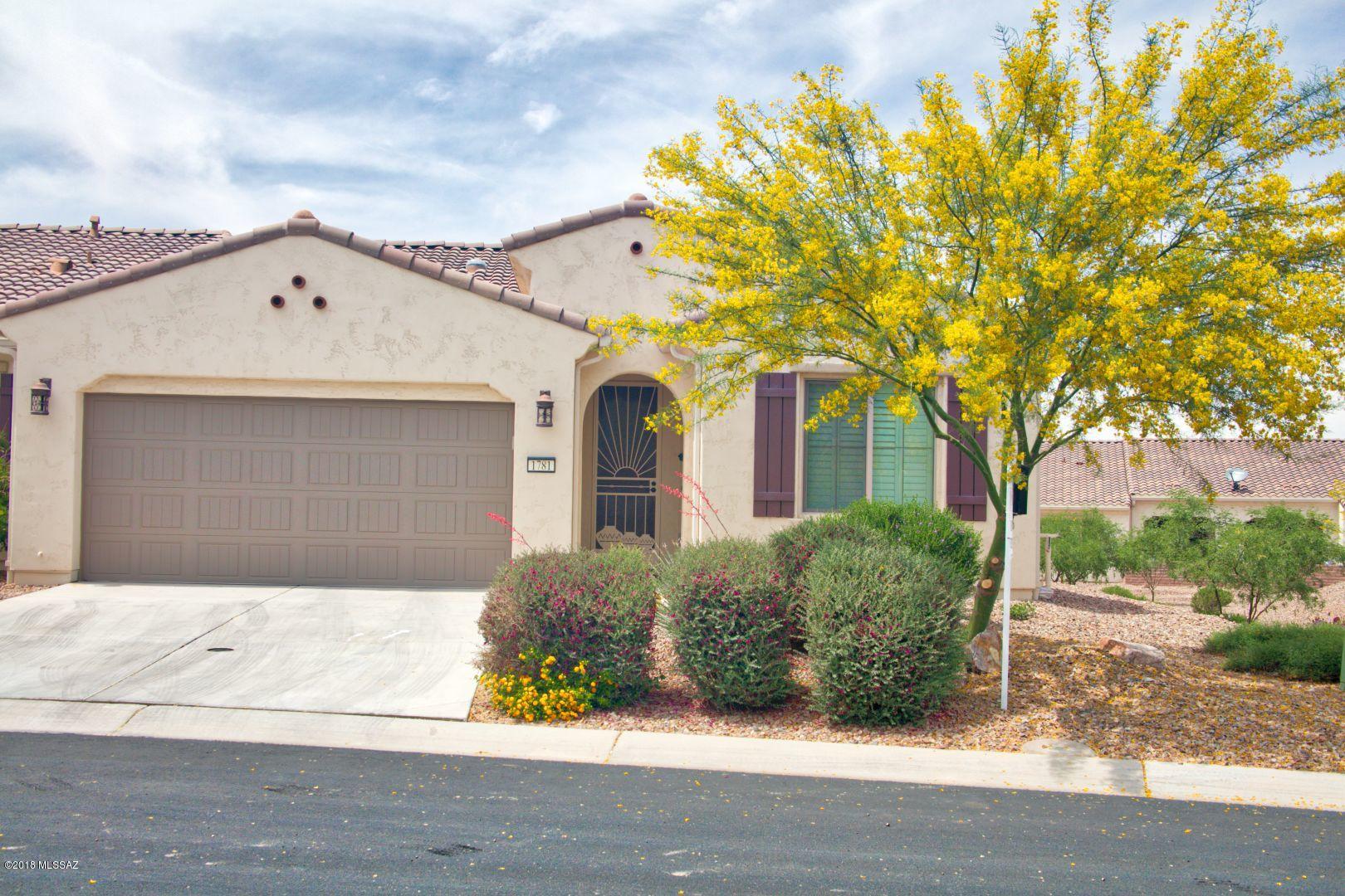 PRICE REDUCED Fall in love with this elegant Primrose villa home.  Designed for luxury living.  Impeccably kept. Stunning upgrades with a beautiful tile inlay entry. Living areas are all tile plus upgraded carpet in bedrooms. Upgraded closet cabinetry in both bedrooms providing ample storage.  Hall laundry has cabinet storage, as well. Premium Lot has wide open spaces all around plus is higher than the homes in the area. Unique Murphy bed  and extra clothing storage in large office area provides a temporary 3rd bedroom space.  Elegant Quartz countertops throughout.  Many well placed Solar tubes provide ample natural lighting.  Upgraded Stainless steel and black appliances are included.  Ready to move in.  All contents are available under separate outside contract. Priced for quick sale.
