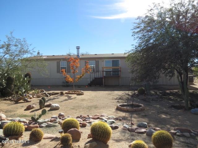 Great opportunity to own a HUD Home and save thousands! Spacious living area with stone surround fireplace. Large kitchen with island and plenty of counter and cabinet space. Newer home with a great open floor plan! Huge master suite with dual sinks, garden tub, and separate shower in the master bathroom. 2nd 2 bedroom 1 bath mobile home on site with its own private yard. Located on a huge over 2 acre lot with desert and mountain views! Please see attached MLS Addendum for property specific disclosures and repairs. Bidding on a HUD Home is quick and easy! Buyers or agents call our office for help with any part of the bidding process.
