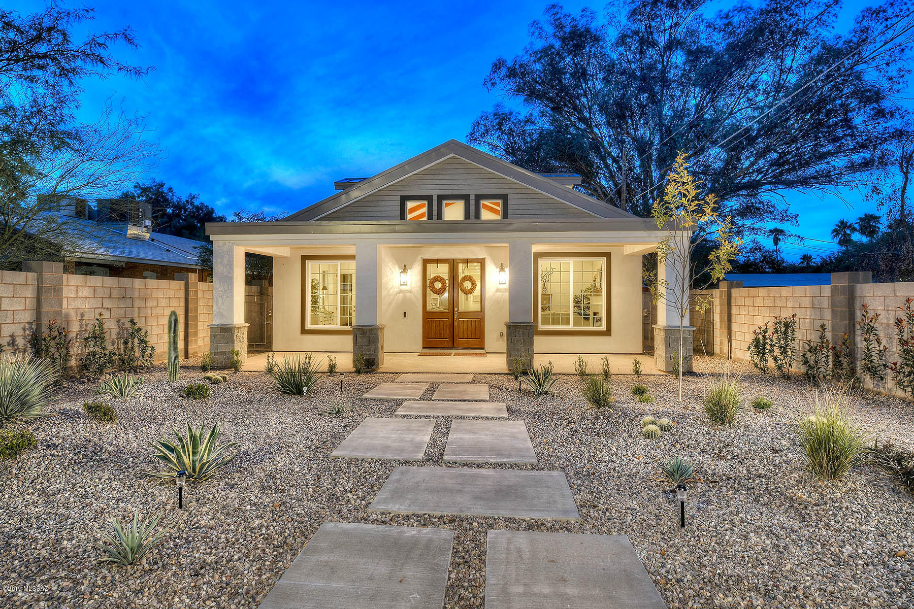 WINNER TUCSON ASSOC. REALTOR BROKER TOUR. NEW contemporary farmhouse home in historic Sam Hughes. Features spacious 2,085 sqft main house & 747 sqft casita. Meticulously designed, open floorplan with clerestory dormers. Lots of natural light. Metal roof. Real wood floors throughout living areas of main house. Gourmet kitchen with quartz countertops, large island, Thermador stainless steel appliances and cobalt Blue Star range. Spacious master bath with dual sinks, shower, garden tub, and walk-in closet. Rooftop patio for entertaining & enjoying the Tucson weather. Private and secure walled yard with entry gates for outdoor area. 3 car garage & additional parking spot for the 1 large bedroom/bath guest Casita. Walking distance to popular urban Tucson spots, shopping, and more. Agent/Owner