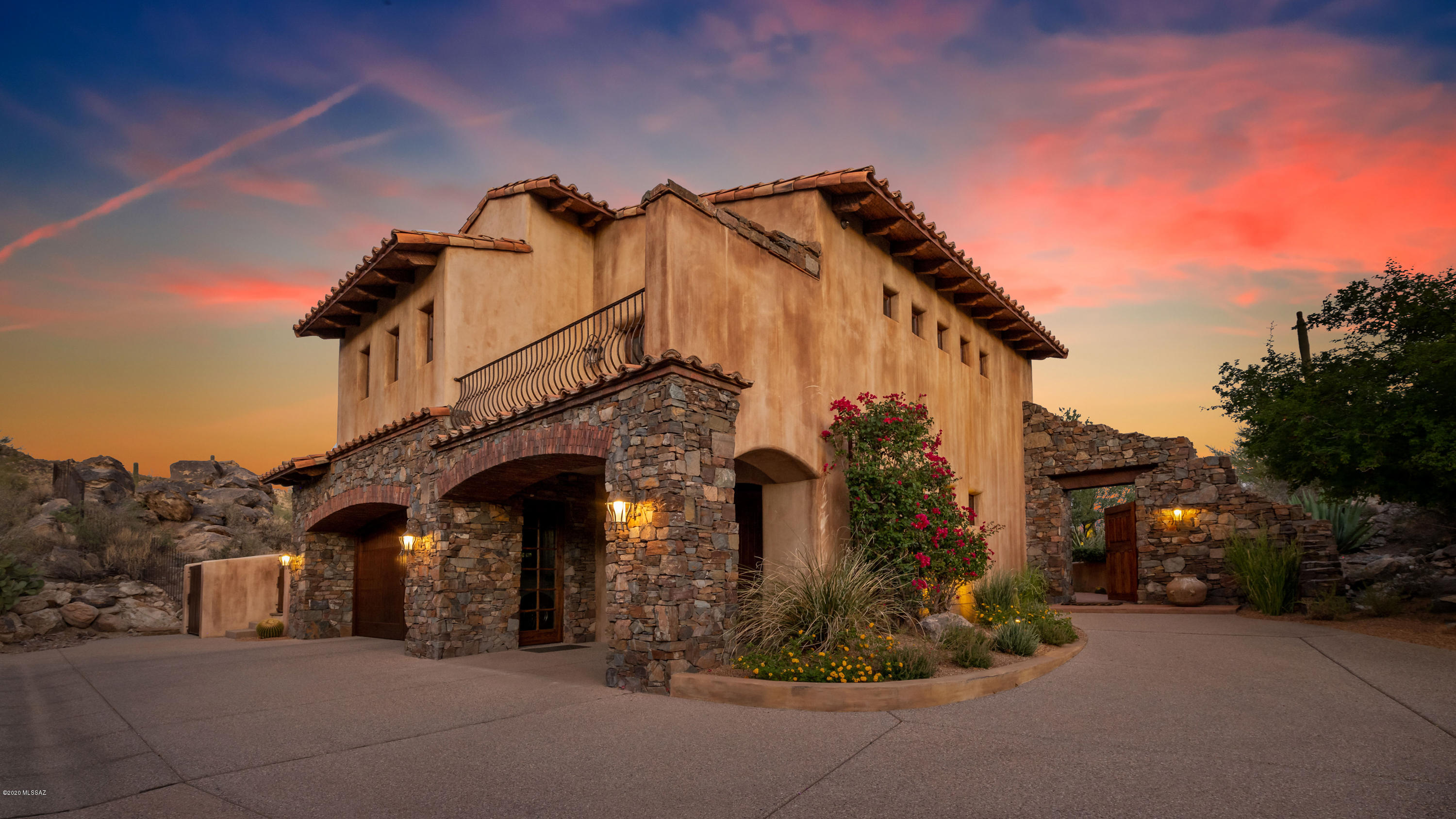 The Hideaway ~ One of the most private tucked away homes available in all of Stone Canyon.  This Hacienda was built with solid high quality materials.  If you are looking for utmost privacy you have found your home. Boulder rock  outcroppings, saguaro studded with views in every direction.  Custom cherry cabinets, chiseled accent front doors and wood beams throughout, leathered granite with custom patterned wood accents, gourmet kitchen, 4 fireplaces for the perfect ambiance in each space.  No words can describe the utter peace and tranquility that this landscape architect has created.  Massive stream erupts from the hot tub flowing in 2 different directions ultimately landing around the home off the grand front patio.  Abundance of trees, shrubs and a bridge leading you to the Casita.  From Day to Night.... retreat from your relaxing main home featuring 2 upstairs bedrooms with ensuite bathrooms and private decks and additional bedroom downstairs with fireplace and access to patio formal and informal dinning to your night time destination master bedroom.  Views flow far and beyond mountain ranges to downtown city lights.  Calming covered patio await you just outside double doors outside Master.  Windows: Dual pane, argon gas filled and tinted. All wood sash in wire brushed cedar. So many beautiful organic materials used throughout this entire home one can only appreciate while viewing the home.  

Stone Canyon Club Sports membership is required.  Belong to one of the most beautiful Country Clubs and settings in Arizona
