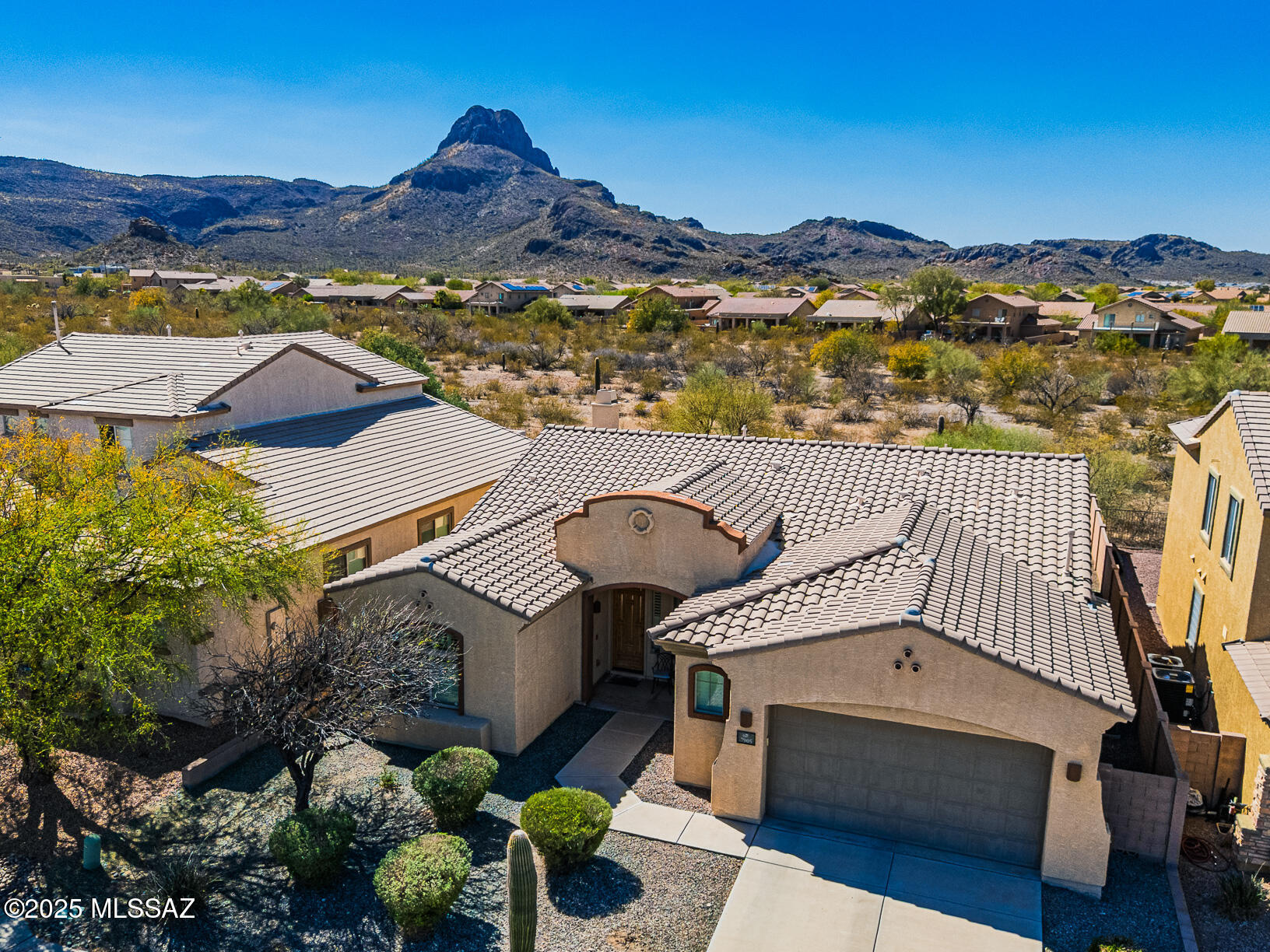 This home has been a winter wonderland for snowbirds, and it's been very lightly lived in. It's located on a premium lot that backs up to an open area and Sombrero Peak. This 3B/2B house has a formal dining room or office, and it's 2,078 square feet. The great room has a fireplace, an open kitchen and dining area, and an upgraded full-length patio. The master suite has a jetted tub, dual sinks, a step shower, and a 2.5-car garage. The kitchen has a breakfast bar, an elevated dishwasher, Corian counters, staggered cabinets, under-cabinet lighting, a H2O filter, and a large pantry. The hall bathroom has dual sinks, a tub/shower, and a linen closet. The house features arches, ceiling fans, in-ceiling speaker prewiring, a skylight, water softener, and new water heater!