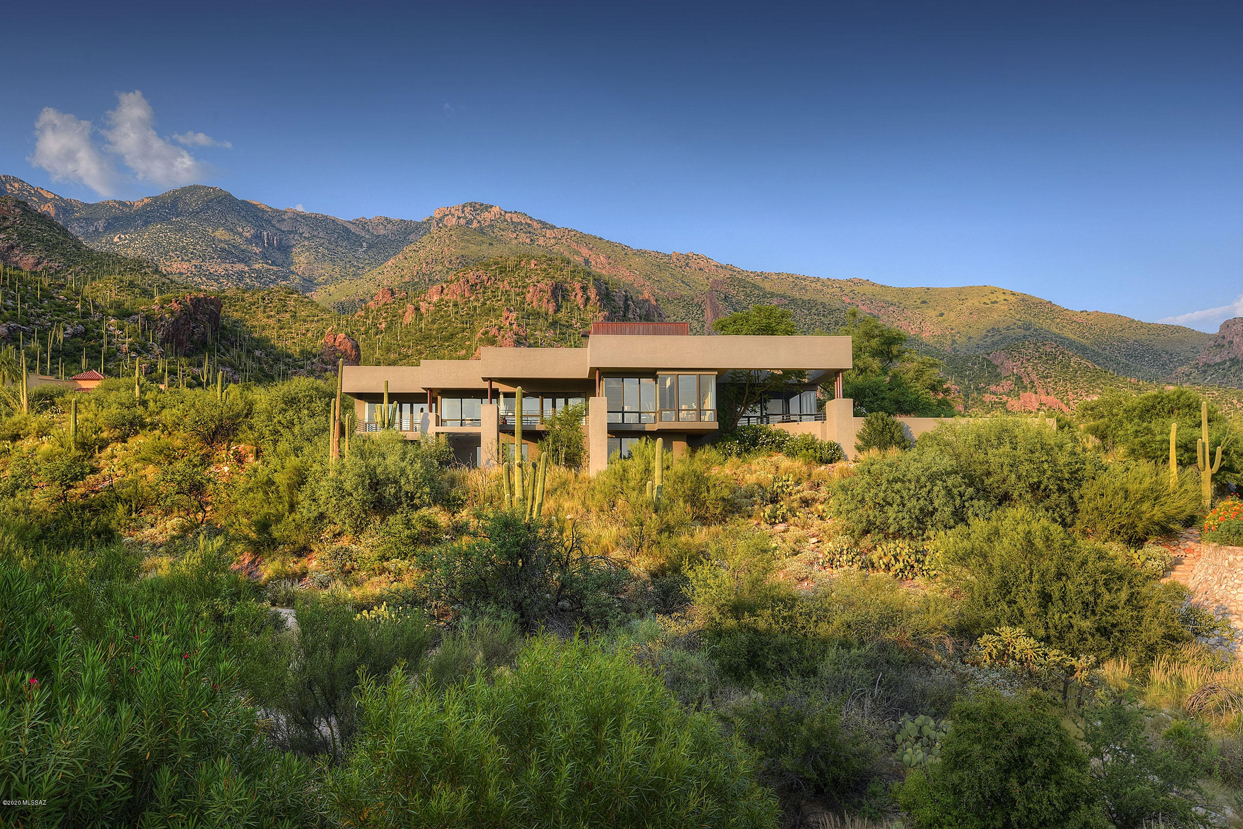 Exquisite Custom Home In One Of The Most Beautiful Neighborhoods You Can Find In Tucson, Arizona.  Once Through the Guarded Gates Of Finisterra, Meander To A Private Homesite Unlike Any Other At The Base Of The Majestic Santa Catalina Mountains.  Statuesque Saguaros, Native To The Sonoran Desert Serve As A Breathtaking Backdrop To The Resort Like Backyard.  You'll Never Tire Of The Colorful Sunsets And Everchanging Mountain Views Visible From Almost Every Window.  Special Interior Finishes Have Been Carefully Considered To Create A Grand Yet Cozy Atmosphere That Is Both Perfect For Entertaining But Also Warm And Inviting For Curling Up With A Good Book In Front Of The Fireplace.  Gorgeous Gourmet Kitchen With Doors And Walls Of Windows Is The Heart Of The Home, It Captures Phenomenal Pool And Dramatic Mountain Views. Many Other Amazing Spaces To Enjoy, Relax, Or Unwind In Including A Lavish Living Room, Funky Fun Family Room (With A Private Balcony To Take In The City Lights), Multi-Purpose Den/Library, Bedroom 5/Game Room, Formal Dining, Or Various Outdoor Patios To Name A Few. Feel Like You Are On Vacation Everyday When You Step Into The Fabulous Master Suite Complete With Private Deck (Again, City Lights) A Stunning Master Bathroom That Is More Like A Luxurious Spa, Featuring An Invigorating Sauna, Rain Shower, Stand Alone Soaking Tub, And Direct Access To The Sparkling Pool. Bedrooms 2-4 Boast their Very Own Bathrooms And All Have Walk-In Closets. All Around An Incredible Property With Surprises Around Every Corner. Excellent Location Near The Best Schools (Catalina Foothills School District), Shopping, Dining, And Entertainment. Must See To Fully Appreciate. Bonus: Newer HVAC System In The Last Two Years.