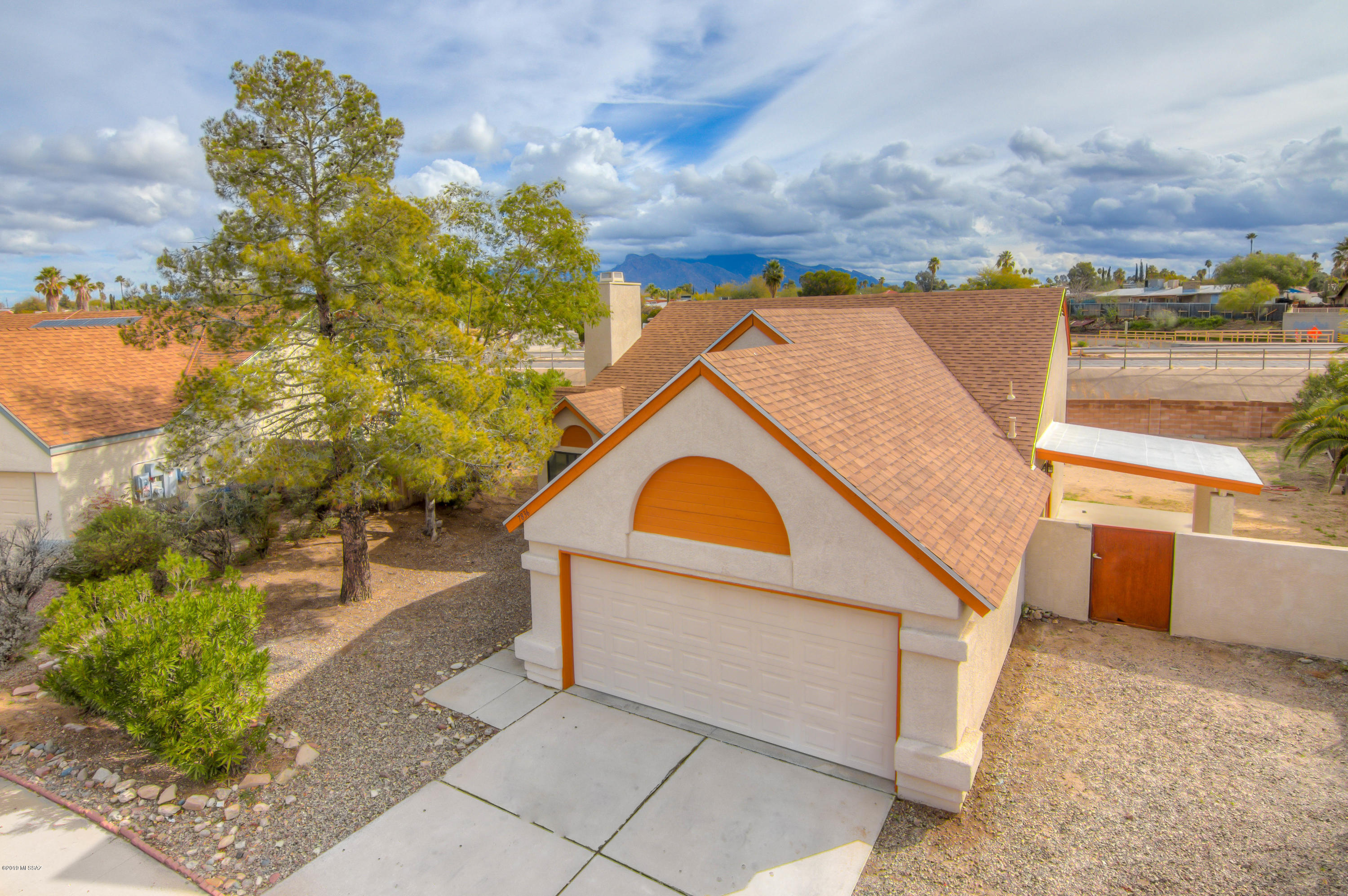 When you enter this beautiful home filled with warm toned ceramic tile throughout you are greeted with a fantastic tiled fireplace and a wide open floor plan making the home perfect for entertaining. The large bathrooms with plenty of counter space, walk in closet and built in shelving in the laundry room give plenty of storage throughout. The wonderfully large, multi purpose rooms let you use your imagination to design the layout of your new home to perfectly fit your needs inside and the close proximity to a great grass filled park and large back yard give you lots of options for enjoying the sprawling mountain views. Come explore your new home today!
