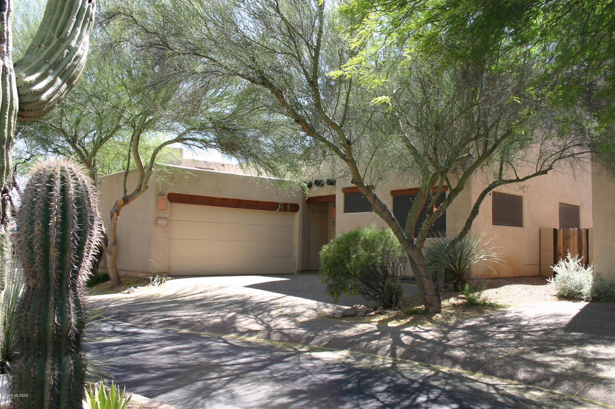Built in 1994. Highly desired enclave of Santa Fe style two story home with community pool. Expansive great room with vaulted ceilings, clerestory windows, gas fireplace lots of tile, Fridge, microwave, electric stove/oven, dishwasher. Washer/dryer. Large master suite upstairs. 2BRs and 1 BA downstairs. Easy access to UMC, U of A, River Walk, great restaurants and Trader Joe's! Small pets are subject to approval and $25/mo pet rent. Security deposit of $2,175. ***Rental Rate reflects a $65 concession in exchange for Tenant's agreement to change HVAC filters monthly. Rental rates are $65/Mo higher than stated w/o concession.***