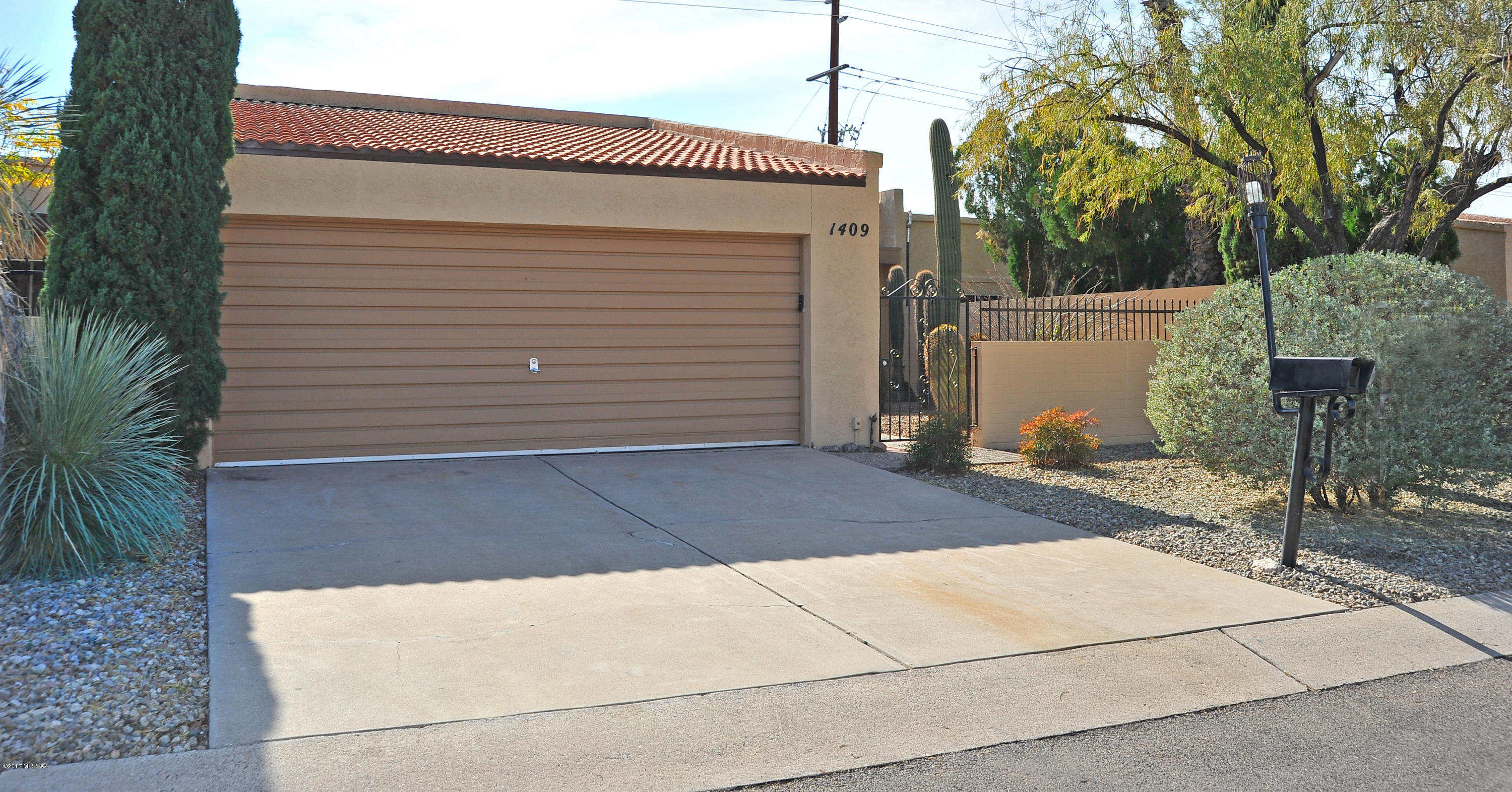 Charming 3 bed/2 bath NW townhome located within Las Quintas community. Home opens to enclosed front courtyard off 2 car garage. The interior features a stylish 20x20'' ceramic tile, high ceilings with fans throughout and carpet in bedrooms. Cozy sized family room includes a wood burning fireplace centered in room with mantel and two separate sliding glass doors to back patio. Adjacent breakfast nook leads into kitchen that boasts cherry cabinets, granite counter-tops with full matching backsplash, S.S appliances and nearby laundry closet. Updated bathrooms along with the master en-suite includes granite counters and fully tiled shower surround. Enjoy the tastefully landscaped backyard with flowerbed or casual evenings under the covered patio or spread out into the extended patio area.