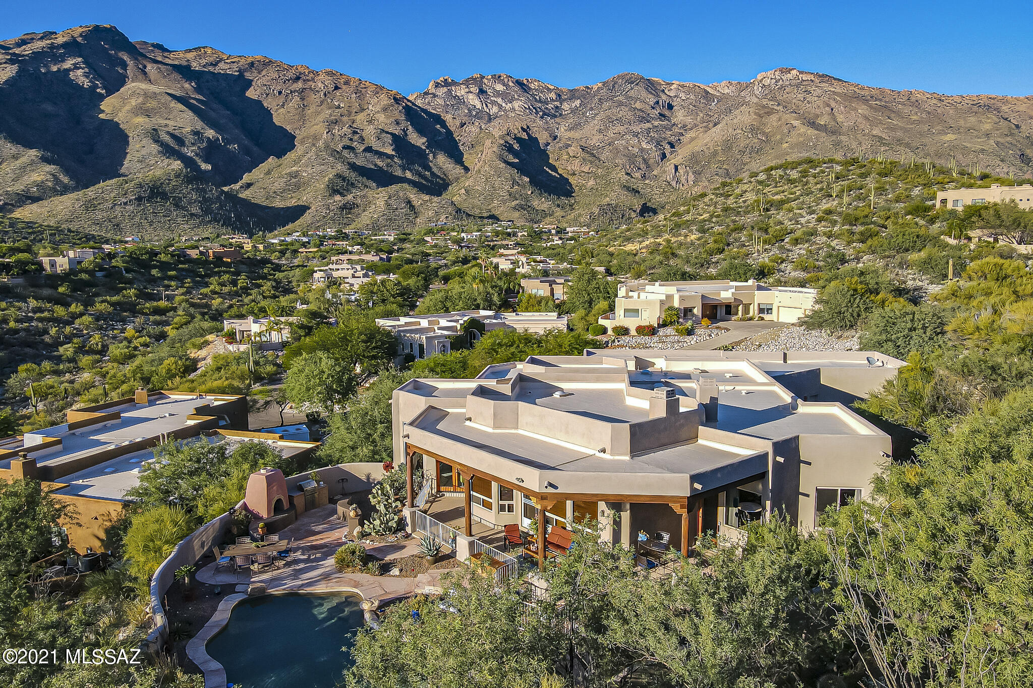 Stunning views of the sunset and mountains from this beautiful Alta Vista home privately situated on a culdesac lot. 4BR/4BA + Den, split floor plan features open island kitchen with granite counters, double ovens, gas cooktop opening to spacious great room w stunning built in cabinetry and fireplace.
Separate formal dining area and living room with walls of windows. Spacious Master BR w fireplace and sitting area, beautiful master bath w jacuzzi tub. One guest room has ensuite bath, walk in closet and built in desk. Two  additional spacious guest bedrooms, beautifully appointed guest bath. Wonderful laundry room w utility sink, lots of cabinets, counter space. Gorgeous resort like backyard
with pool, spa, barbecue. Cozy up to the outdoor fireplace and watch the beautiful desert sunsets.
