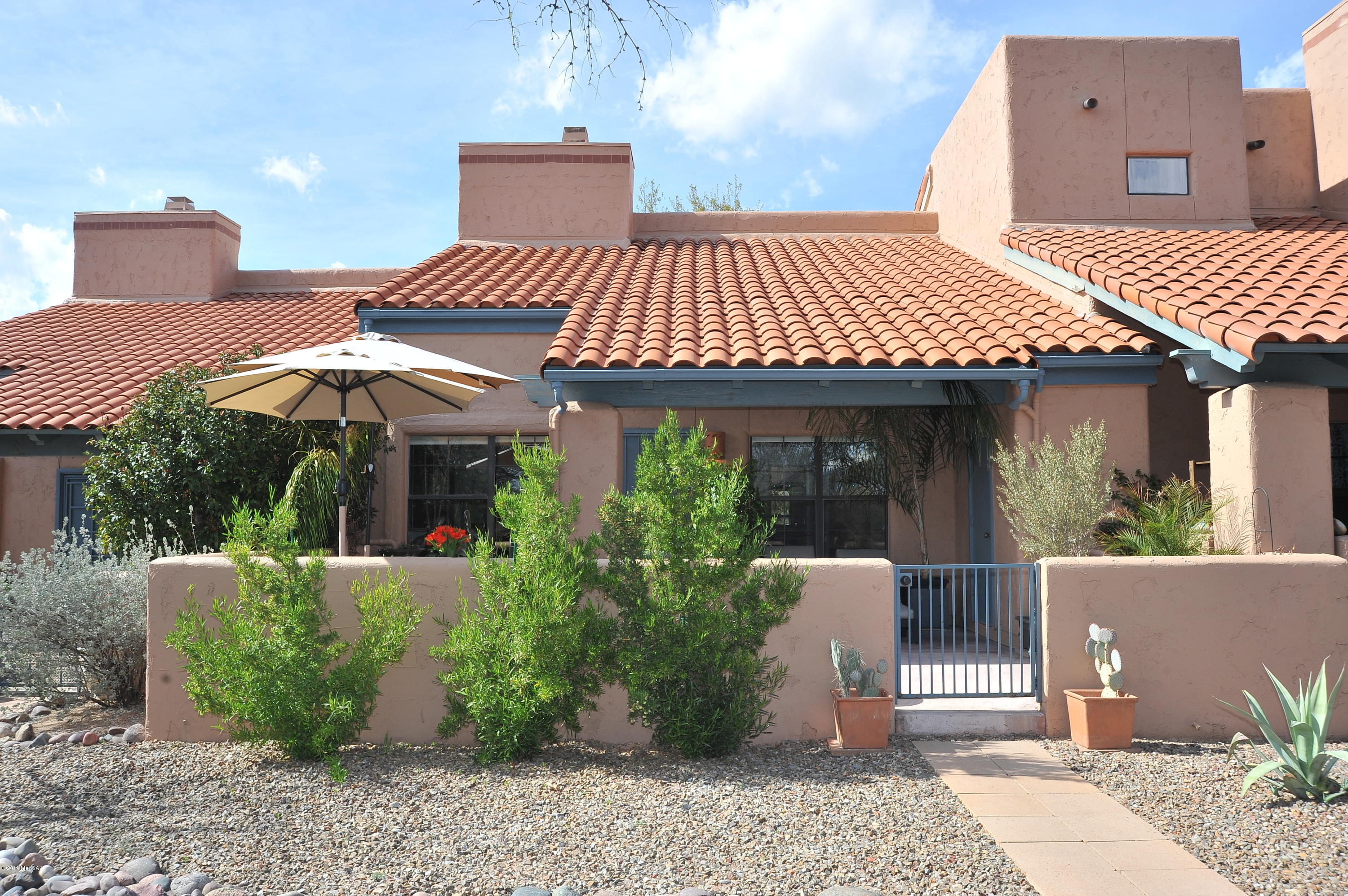 Range priced $179,900-$195000 Come see this stunningly remodeled single story townhouse in sought after Ventana de Sabino with soaring ceilings, gorgeous tile floors and distinctive cabinetry, doors and fixtures throughout. Make this your first stop and skip the rest. The wonderful community has incredible landscaping, 2 pools and is located just a couple blocks from the jewel of Tucson... Sabino Canyon. Enjoy the outdoor living space on one of the largest patios in the community. The dramatic fire place offers hours of enjoyment around a toasty fire.