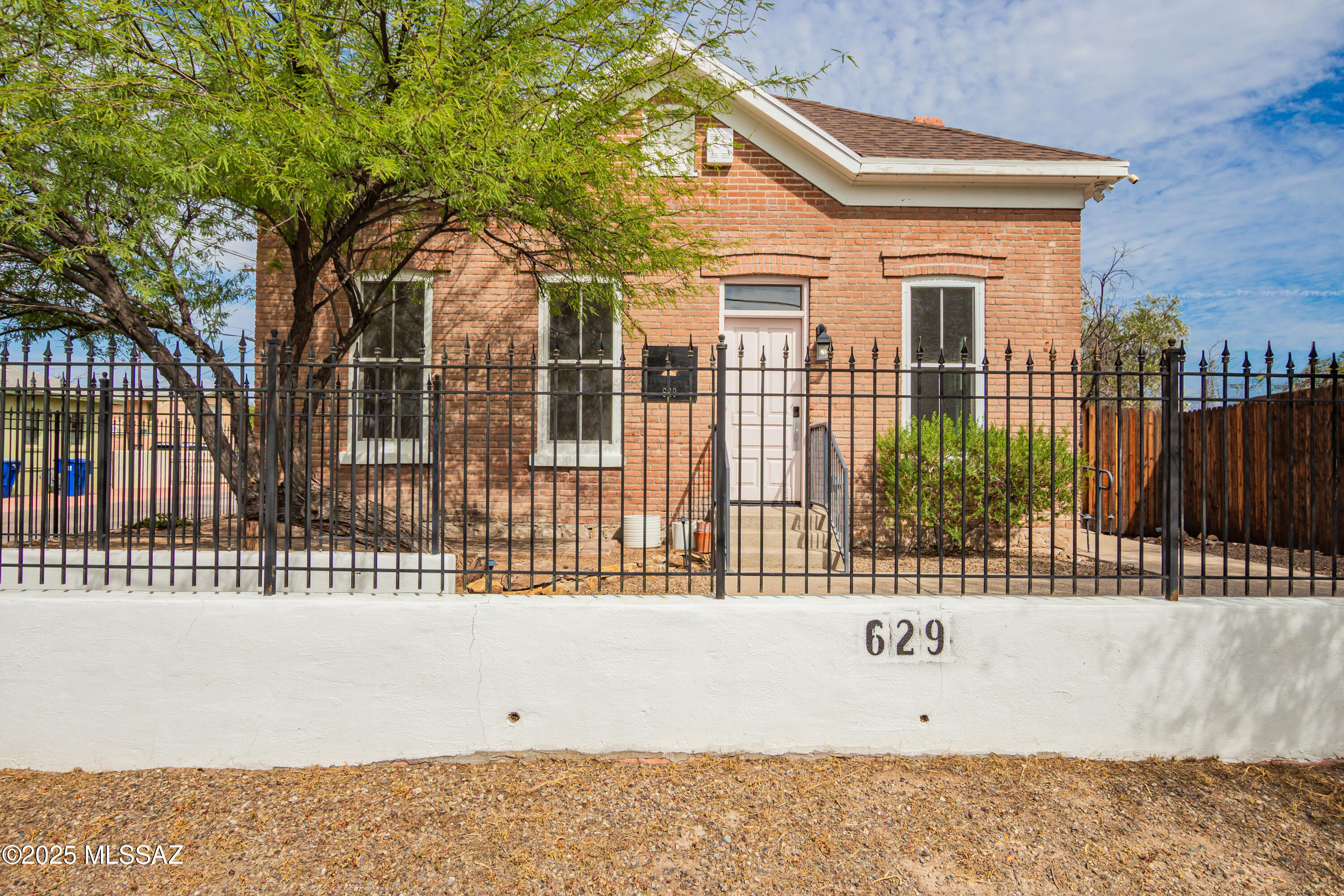 Historic Old-World Charm Near U of A & Downtown----
Step into timeless character and versatility with this 1,568 SF brick building, offering endless possibilities for retail, office, studio, or gallery use. Featuring 12-foot ceilings, beautiful hardwood floors, and classic architectural details, this property blends historic charm with modern functionality. Located just minutes from the University of Arizona, Downtown, and 4th Avenue, it's perfectly positioned for visibility and convenience.