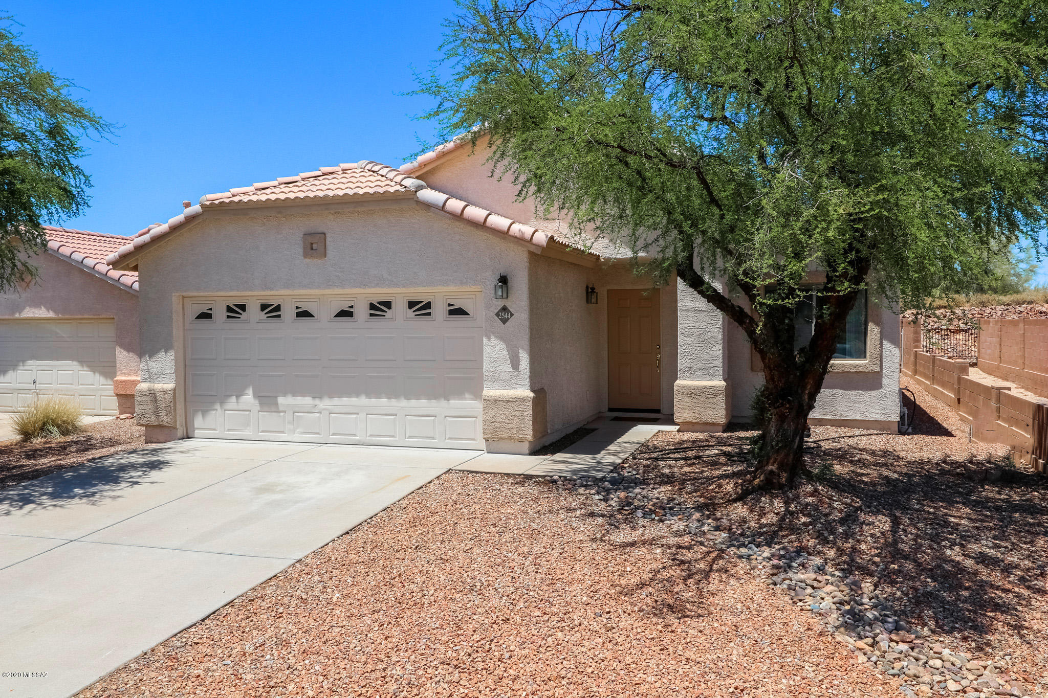 Clean and well maintained 3BR in coveted area within minutes of all essentials boasts UPDATED baths including beautifal vanities, new toilets, light fixtures, FRESH paint, NEWER HVAC.  Master BR with walk in closet. Kitchen with bar/island, side by side refrigerator stays, oak cabinetry. Vinyl plank and well kept clean carpet throughout. Dual pane windows. tile roof, spic and span garage, low care yard with block wall - NO neighbors behind and pleasant mountain view.  More:  added shelving in garage, new gravel front/rear, new fans in BR (remote controlled), new window coverings.  Won't last!