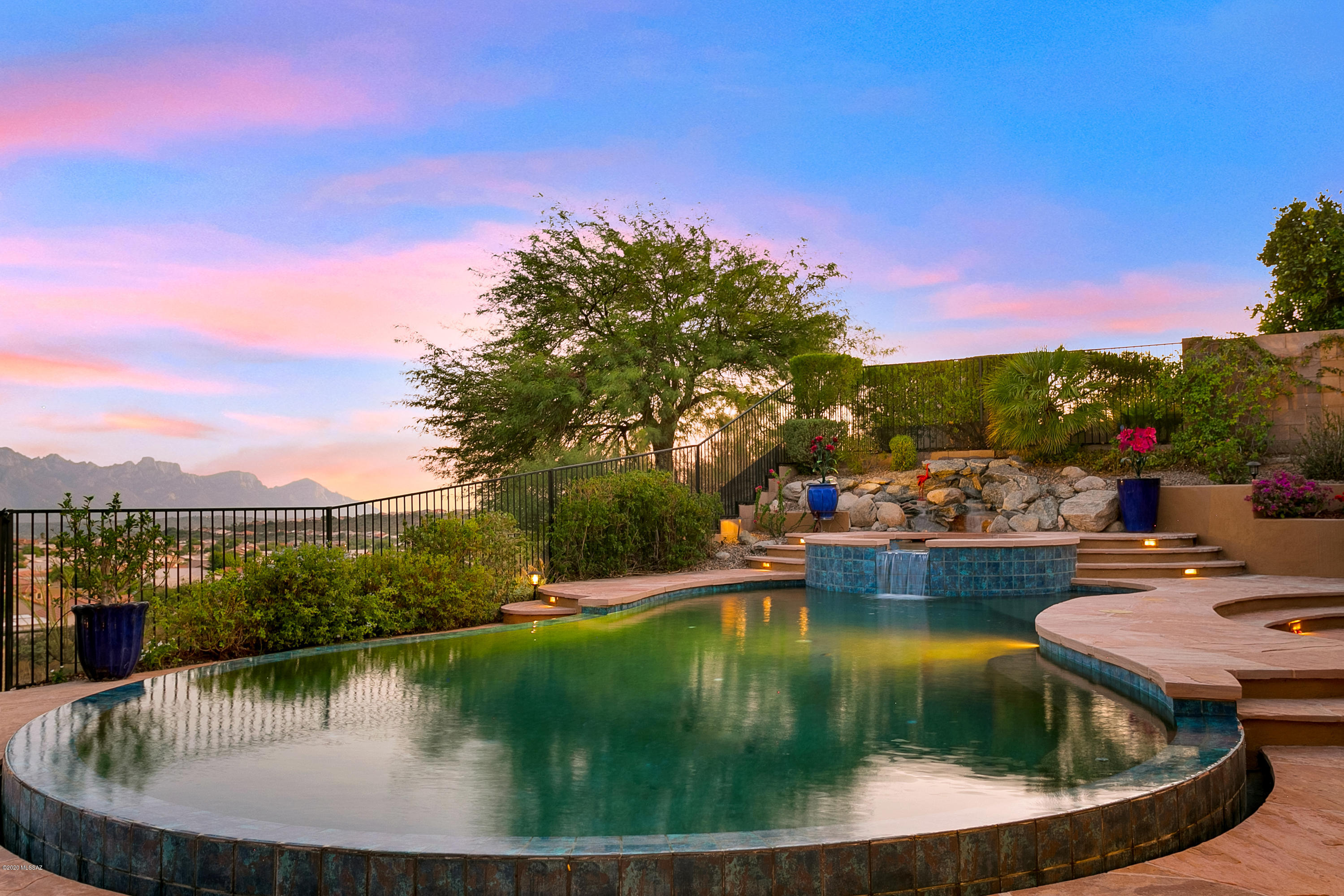 Bring your most discriminating buyers to see this SONORAN home with casita and spectacular mountain views in The Preserve at SaddleBrooke, Tucson's Premier Active Adult Retirement Community. The interior was professionally decorated and features slab granite countertops, Travertine tile backsplash w/vineyard mural, butler's pantry , upgraded appliances, upgraded kitchen cabinets, under cabinet lighting, plantation shutters, six solar tubes, and more. Many added electrical outlets and switches including a 240 volt 50 amp 3 prong RV outlet & an 80 subpanel. Gorgeous backyard with a custom designed negative edge gas/solar-heated pool, spa & waterfall, outdoor kitchen & gas fireplace and the list goes on.