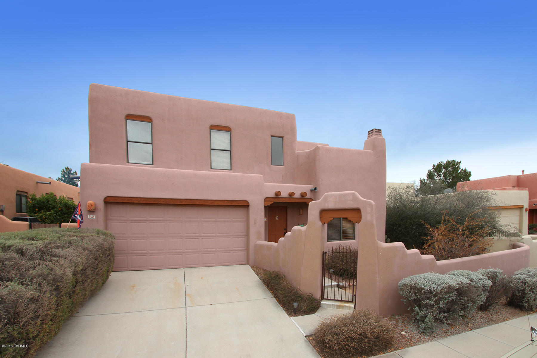 PRICED TO SELL! Former Bednar Model. From the front courtyard to the sparkling pool, this 4 Bed/3 BA with Separate Living/Fam/Dining Room gives you entertaining options!  Eat-In Cooks Kitchen & Breakfast Bar upgraded in 2014 w/Stainless Appliances, Gas stove, Granite, Undermount Sink and Custom Backsplash.  Gorgeous Viga Beams, Octagon Saltillo floors, Stone Fireplace & Bar give the LR tons of character. Large MASTER SUITE DOWNSTAIRS opens to its own Private patio. MB w/ Sep. Shower/ Tub.  Complete Privacy -Large Covered Patio overlooking Resort-like Back Yard that backs onto open Natural Desert. N/S Exposure with Mountain Views enjoyed from the Pool!  Upstairs, 3 Beds & Bath w/ 2nd Story Patio to Enjoy Incredible Mountain Views.  LARGEST MODEL WITH TONS OF CHARM!