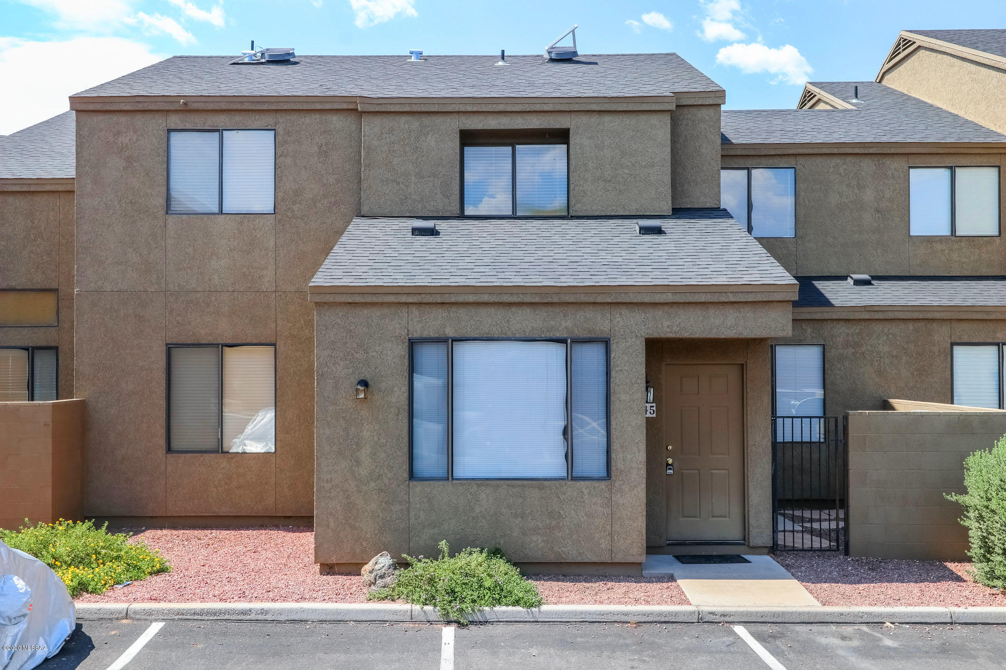 This 3 BR 2 BA condo offers upgrades through out, a private patio & a two car garage. Located within Park Place Condominiums with a community pool & spa. Great location is convenient to upscale shopping & dining, U of A, Downtown, mountain ave bike path & the river walk.  Great room floor plain with high ceilings, one BR and full bath downstairs, over sized closets (two bedrooms have walk-in closets), granite counters, and all appliances inc. washer and dryer. Plus visitor parking is just in front of front door. Great rental potential given the close proximity to UA Ag center & main campus.  **New HVAC June 2019. Don't miss this move in ready home!