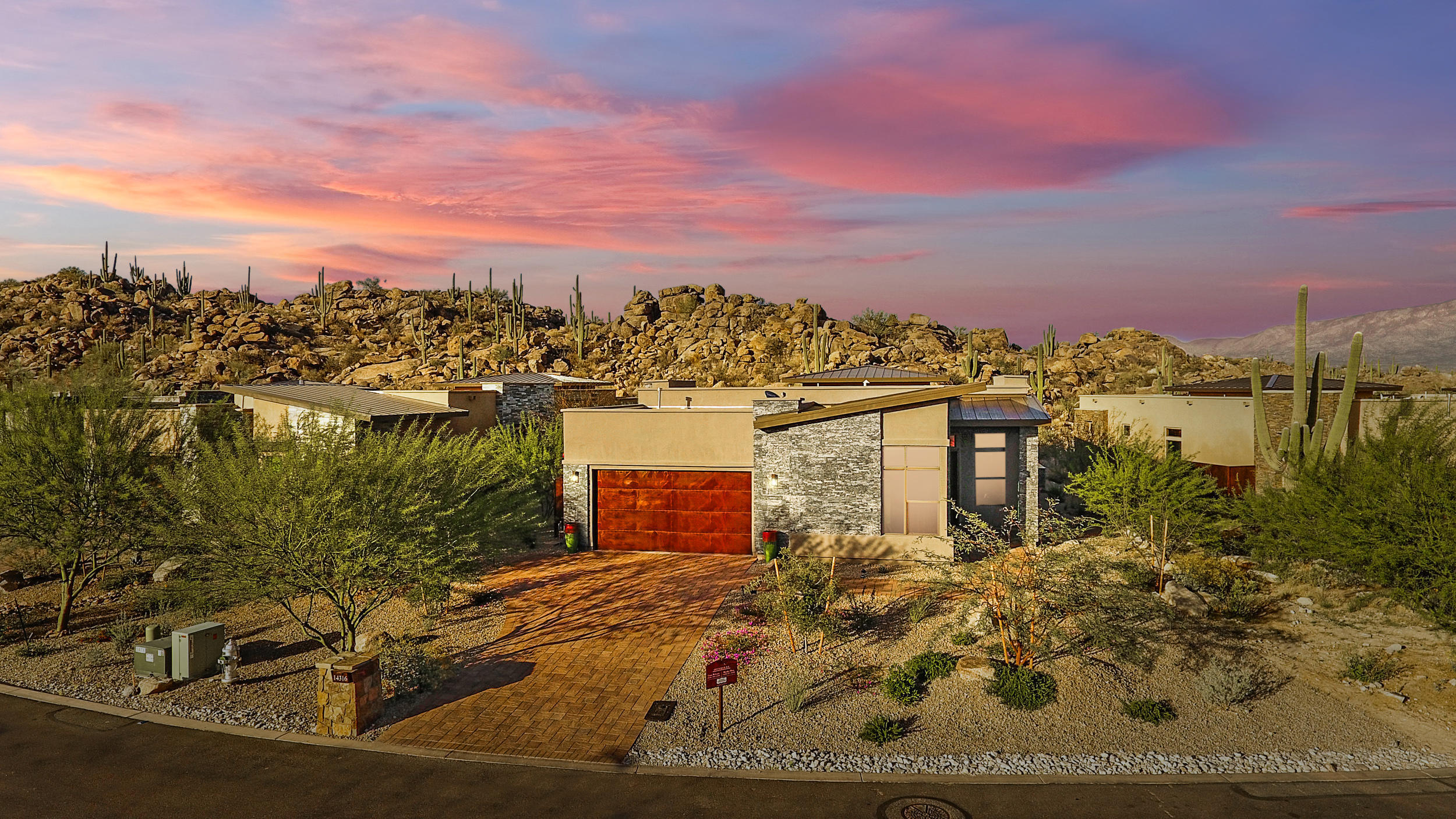 Luxury living at its best!!! New contemporary home located behind the gates of Oro Valley's finest community - Stone Canyon.  Surround yourself with natural rock outcroppings, Majestic Saguaros and breath taking VIEWS.  This house offers so much more than views!  Every room is filled with high-end finishes and attention to detail.  The home is a spacious 2751 SF open floor plan.  The split floor plan has 3 bedrooms - each with it's own en-suite bathroom. Each bedroom has it's own walk-in closet - and beautiful wood floors. There is also a den/office, powder room, laundry room, walk in pantry and a 2 car garage. Hunter Douglas motorized shades on every window. Extra features include contemporary light fixtures - like you'd see in a magazine. The outdoor kitchen has a beautiful black granite countertop with a grill and outdoor fridge to make entertaining easy. After a hard day of golf or cycling jump in the spool to soak.  After dinner on the patio enjoy sitting by the fire pit.
Call Listing agent for a appointment today.