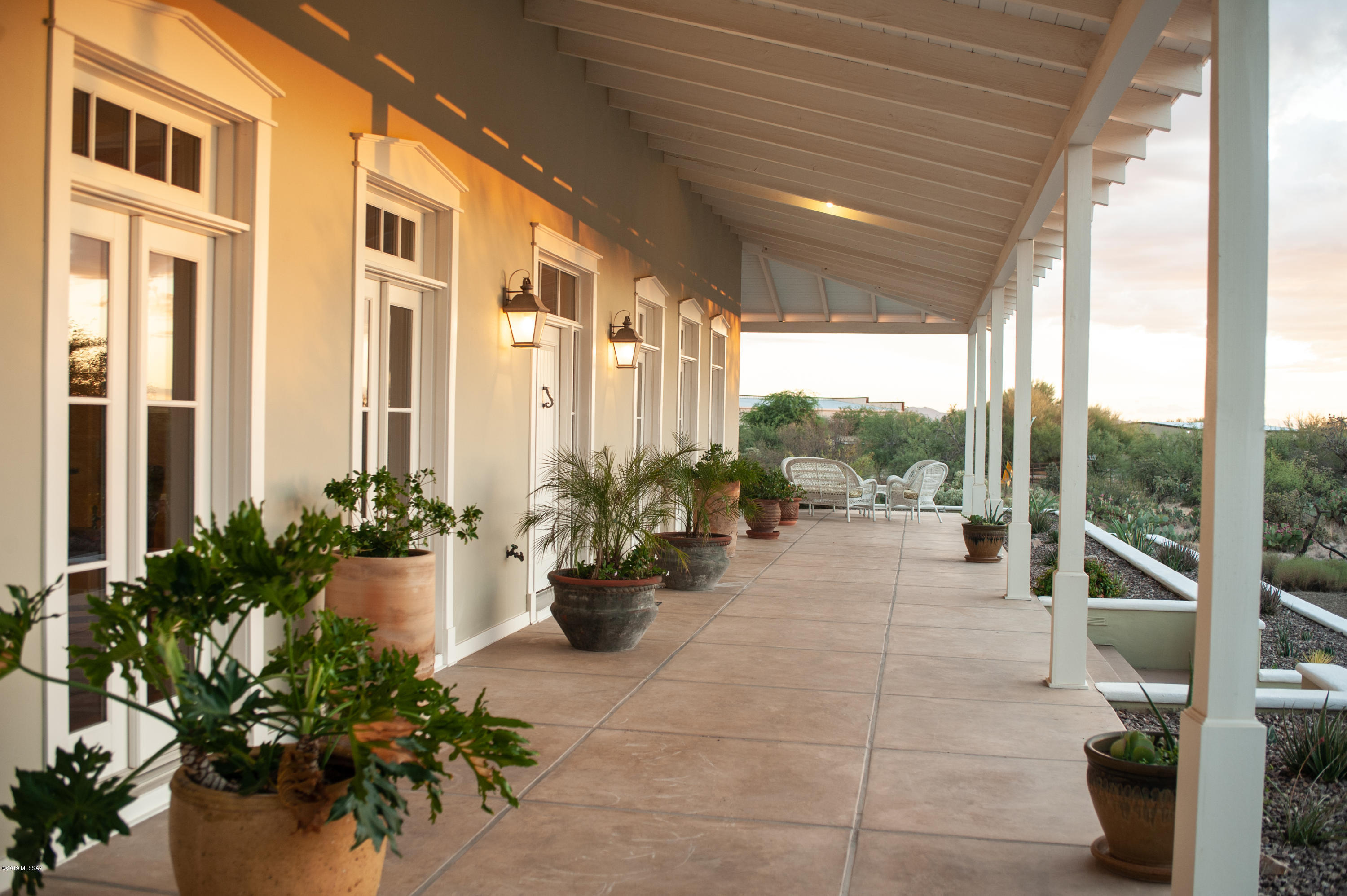 Spacious Residence in La Cholla Airpark  resting on 7.09  acres that has access to a private 4,670 ' runway and zoned for Horses!!!Stunning Panoramic Views Of The Catalina & Tortolita Mountains.  Indulge yourself in luxury and robust living of 5,659 sq. ft exceptional designed house with traditional style and acclaimed interior design.   First Floor highlights include red birch flooring, windows that are framed into the setting of the mountain ranges, solid wood beams, glorious entertaining space, piano room, and office.  The Culinary Kitchen and Dining space speaks for itself.  Second floor has two En-suite Bedrooms with outdoor balconies.   Lower level set up for Movie  Theater Seating, Exercise Room and added space. Separate Five Car Garage!!  Furnishings Available. Outdoor Entertainment is easy with a Full Wrap-Around Porch, planter boxes, Patio seating, Outdoor Kitchen and low care desert plants.  And Yes, the 5 Car Garage is equipped for everything you can imagine!

Out your front door, begin to enjoy  World Class Cycling, Hiking, The University of Arizona, Foodie Haven, and additional adventurous fly-ins throughout the Southwest.   Oh!  Horses are allowed too!   Give yourself the opportunity of a lifetime to step into this full filled property with many possibilities and life enriching experiences in the Tucson area!