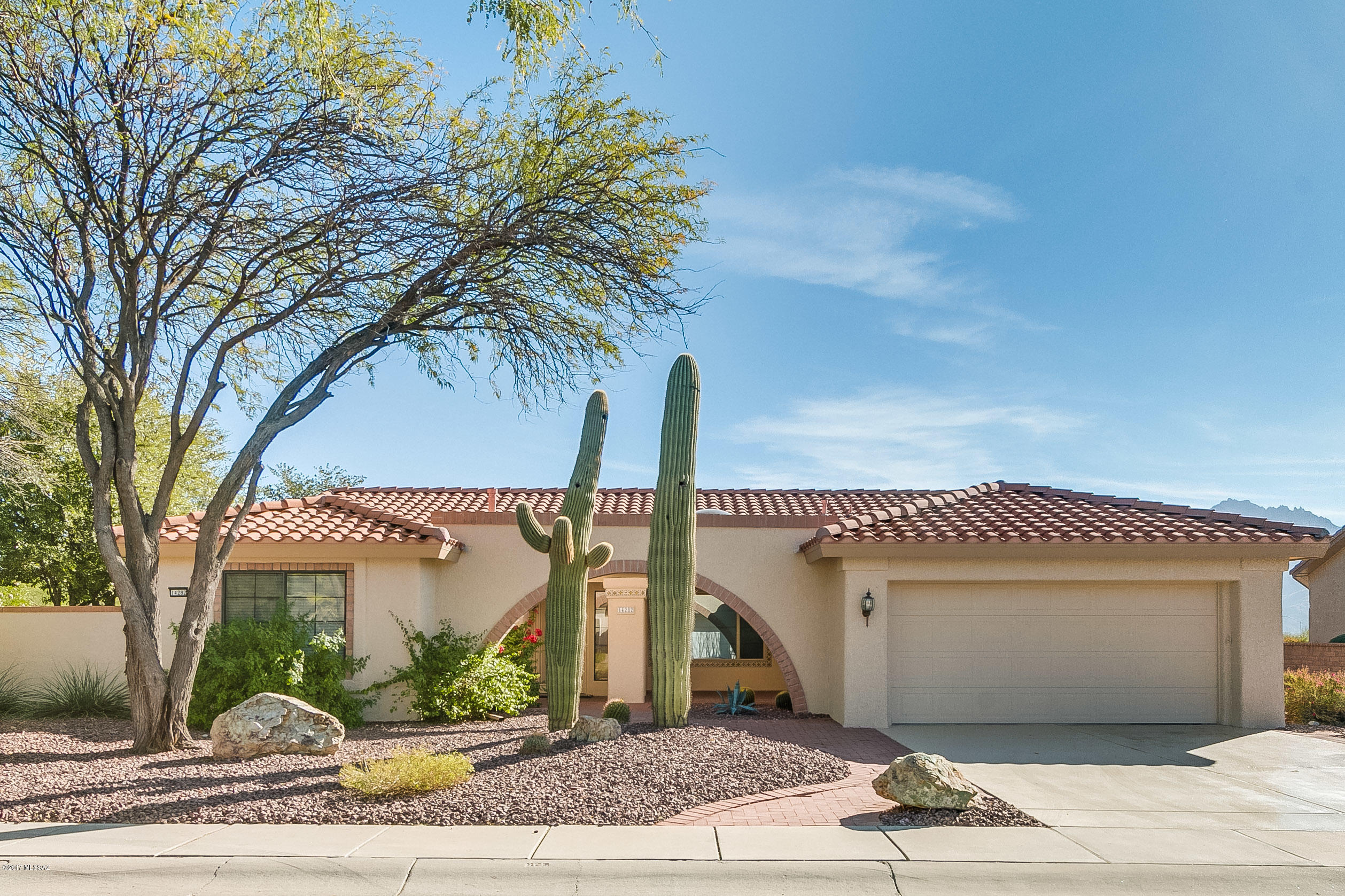 Popular Silvercreek floor plan with spectacular panoramic mountain views. Enjoy the best views Sun City Vistoso's active adult community has to offer in a 2BD/2BA + den(1,625sqft) home. The recently remodeled open concept kitchen includes new appliances. Large master bedroom, with luxury bath & plenty of windows to maximize the view. Property is set on the golf course with lush vegetation ensuring privacy. Other renovations include newer irrigation, interior/exterior paint & epoxy coated driveway.  Outdoor living at its finest with covered/uncovered patios, pavers, fruit trees & a cacti garden. Bask in the unobstructed mountain views reflecting the gorgeous sunsets. Short walk to SCOV center with amenities. This home is in immaculate condition and perfect for the most discriminating buyer.