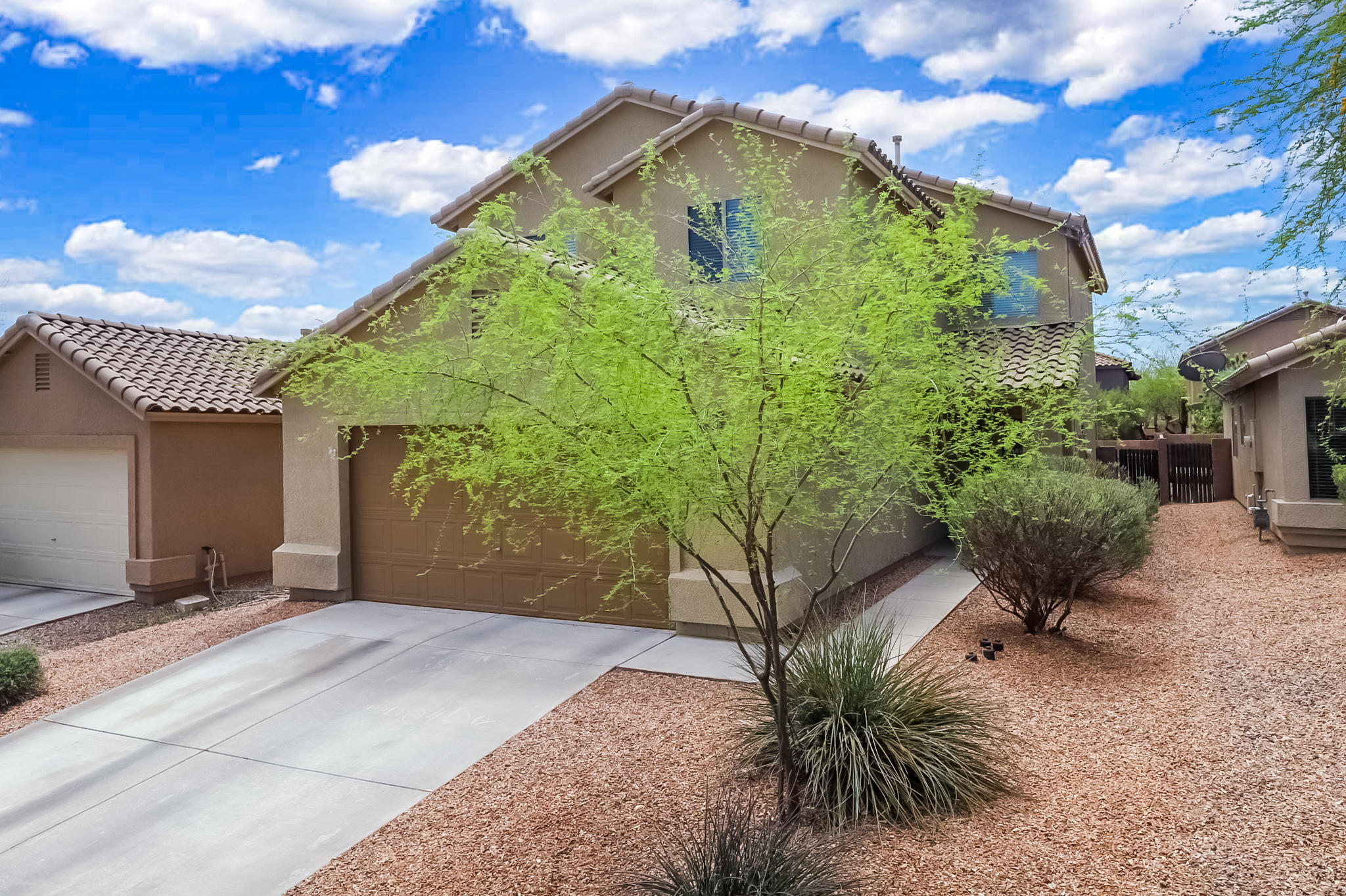 This move-in ready, open floorplan features a spacious great room, designated dining area, and a beautifully appointed kitchen with raised-bar island, upgraded appliances & plenty of cabinets. Full bathroom and bedroom on first floor are perfect for guests.  The second floor features a large loft area, two full baths, three bedrooms and a master suite.  Sliding glass door leads to large backyard landscaped with pavers, grass and decorative rock.   This home has a Green Valley mailing address, but is located in the Sahuarita School District. Low HOA dues! Close to shopping, restaurants & I-19.