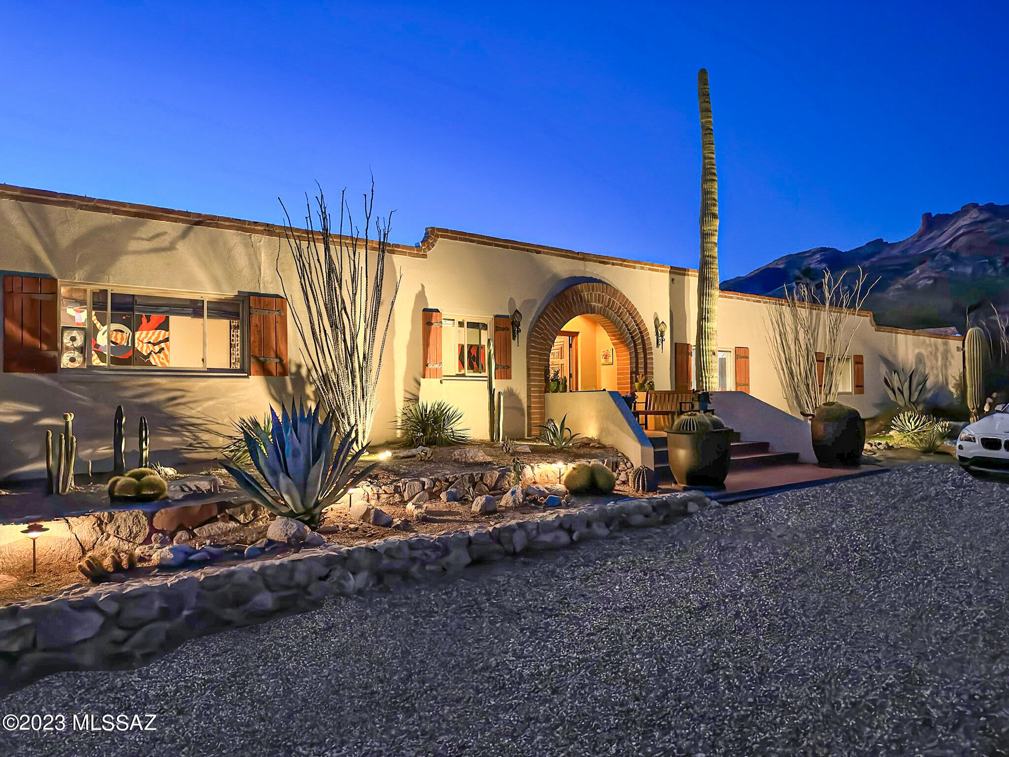 Superb Catalina Foothills location featuring incredible mountain views plus city lights! This home would be perfect for an artist or dancer. The walk-out finished basement has a cozy, wood burning fireplace and ample room for storage. The living room and great room both feature a wood floor that would be a ballroom dancer's dream. There are two separate entertainment areas. One is by the pool with a built-in barbeque area and two levels to view the city lights. The other is a lush brick courtyard with koi ponds and soothing waterfalls, featuring a mountain view. Plenty of guest parking for there is a gigantic semi-circular driveway plus extra parking at the rear of the house. There are 2 electric car charging hook-ups available. The solar panels on the rooftop are included in the sale.