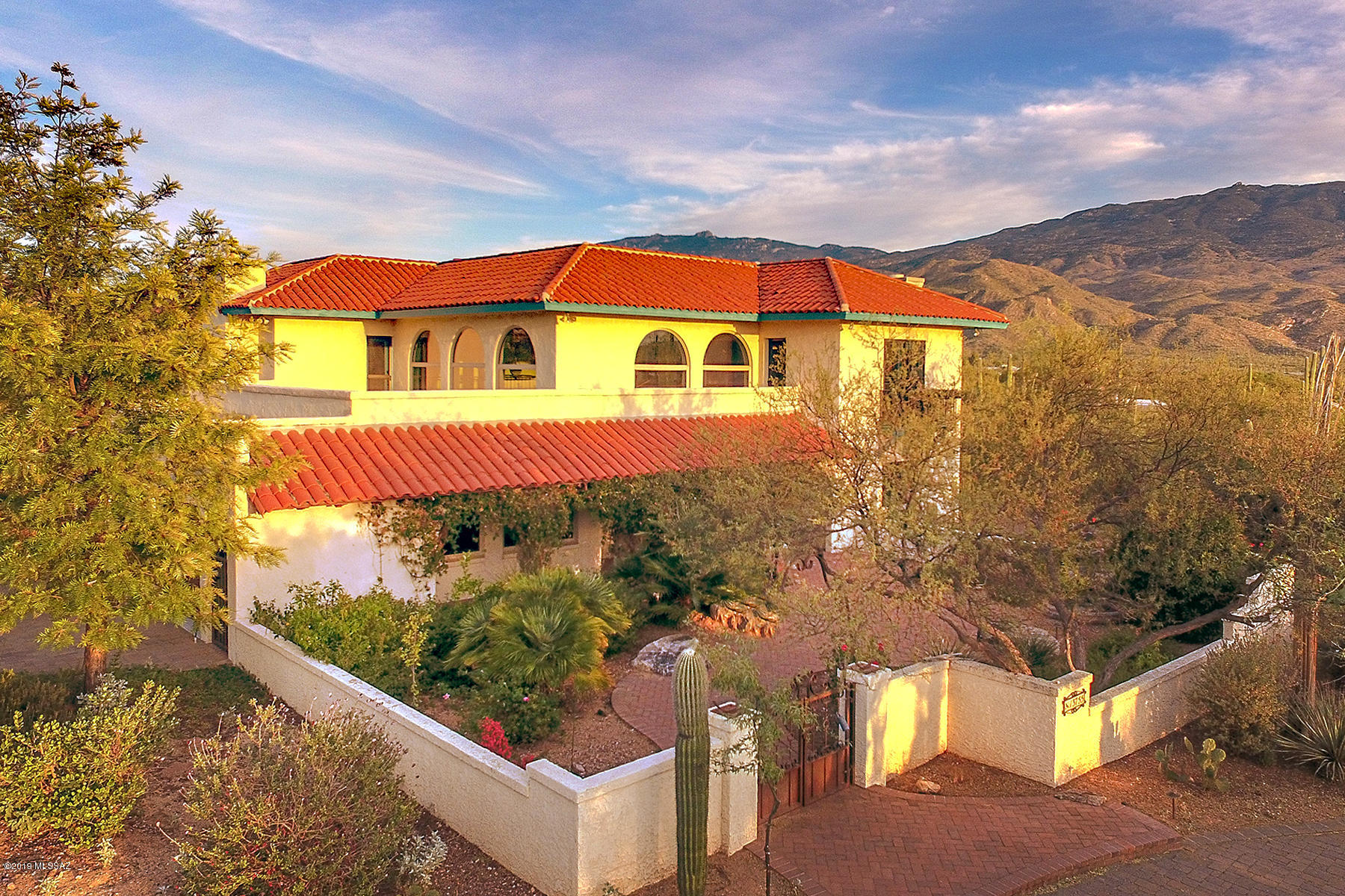 Magical Southwestern home on 3.3 acres in exclusive La Cebadilla Estates. Updated in all the right places, w/custom hand painted murals & finishes. New open kitchen w/stainless appliances & whimsical touches from the mesquite breakfast bar to the colorful Mexican tile work.  Great entertaining spaces inside & out, showcase walls for artwork in living rm. Grand staircase takes you to the 4 bedrooms-2 ensuites. Generous covered porch across the back overlooks Reddington pass & hundreds of saguaros. Outdoor entertaining with pool/spa outdoor shower, kitchen, firepit, fireplace, view fencing and privacy. Guest house/mother in law/studio? your call.