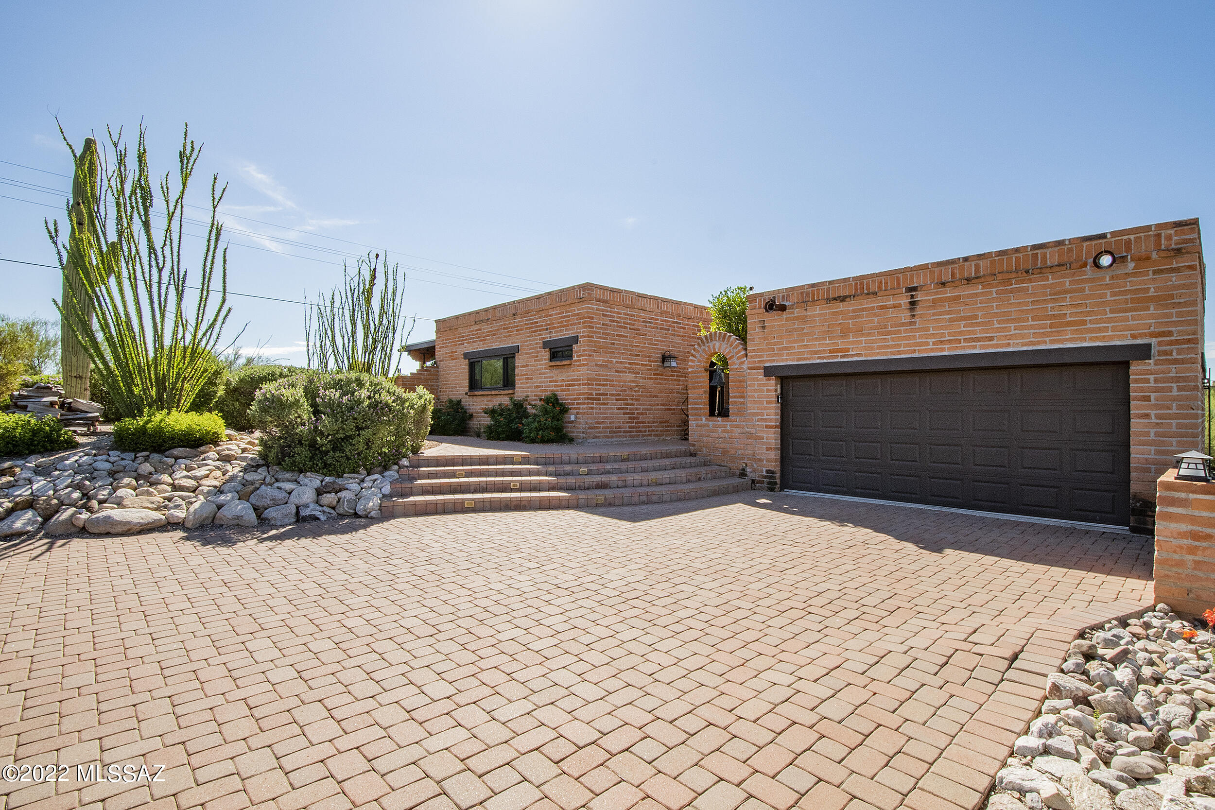 Range priced $845k-$865k -- Views, Views, Views from the highest lot in the neighborhood!  City lights, mountain and sunset views are sure to wow you!  From your perch you can gaze out to downtown Tucson, U of A stadium, A-Mountain and even Kitt Peak all from the kitchen, dining, family room and BBQ deck.  This foothills charmer was originally built in 1977 but underwent a large remodel in 2017 which adjusted its effective build date to 1987.  Bonus to you!!  It's an easy flowing floor plan with 2,539 square feet, 3 bedrooms, 2 1/2 baths, TV / Living Room with Fireplace and Dining Area.  The updated kitchen offers soft close cabinetry and drawers, pull out shelving, large island with power, shelving and bar seating for 3, new beverage fridge and wine fridge and induction cooktop....Cont... Newer Anderson windows throughout. There are two separate patios with a pass through pet area - one is on the south side of the house with built in BBQ grill, wood burning fireplace, al fresco dining and outdoor TV.  The second patio is on the east side of the house and provides a covered patio, outdoor TV, water fountain, pebble tec pool that goes to 8' in depth and has great shade during the afternoons on those hot summer days plus solar coils to extend that swim season.  The 2 car garage is heated and cooled and also provides two separate storage rooms and the whole house water softener. New HVAC system, water heater and PVC irrigation installed in 2021.  Low HOA Agent / Owner