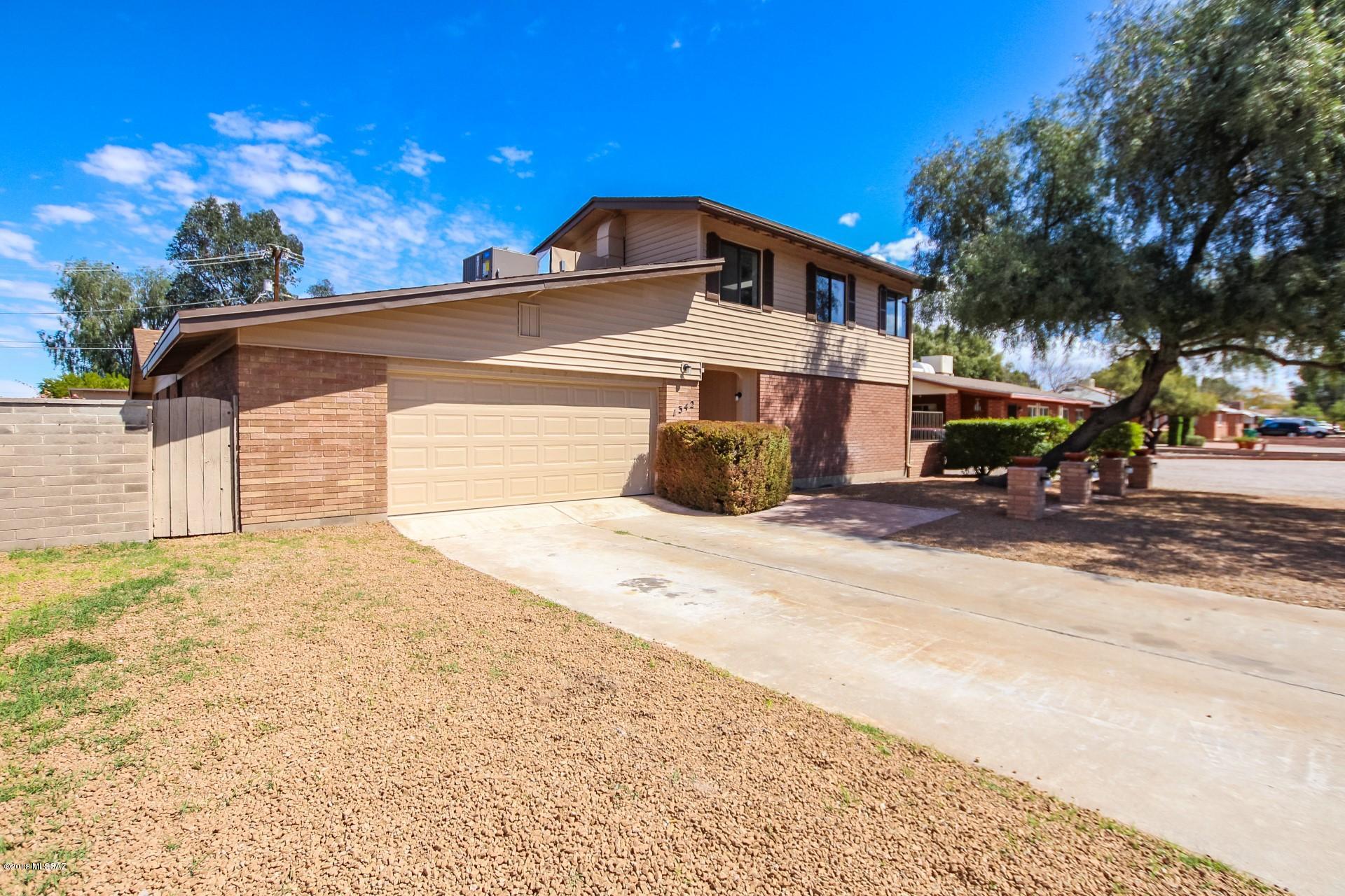 Exquisitely Remodeled Contemporary Home nestled on a corner lot and move-in ready! Custom interior palette, gorgeous wood ''look'' tile floors, new plush carpet/padding in all the right places, soaring ceilings, wall of sliding doors to courtyard, cozy brick fireplace, ceiling fans, some white washed vaulted ceilings, skylight, and patio access from family room with built-in entertainment wall. Stunning new kitchen features stone counters, SS appliances, pantry, recessed lighting, and white wood cabinetry. Perfect Home for entertaining inside and out. Large laundry room, ample closets, and 2.5 upscale baths. Generous size bedrooms! Bonus room on 2nd level with endless possibilities. Sparkling diving pool, patio, fire pit, RV Gate, & storage shed complete this incredible Home. Will NOT last