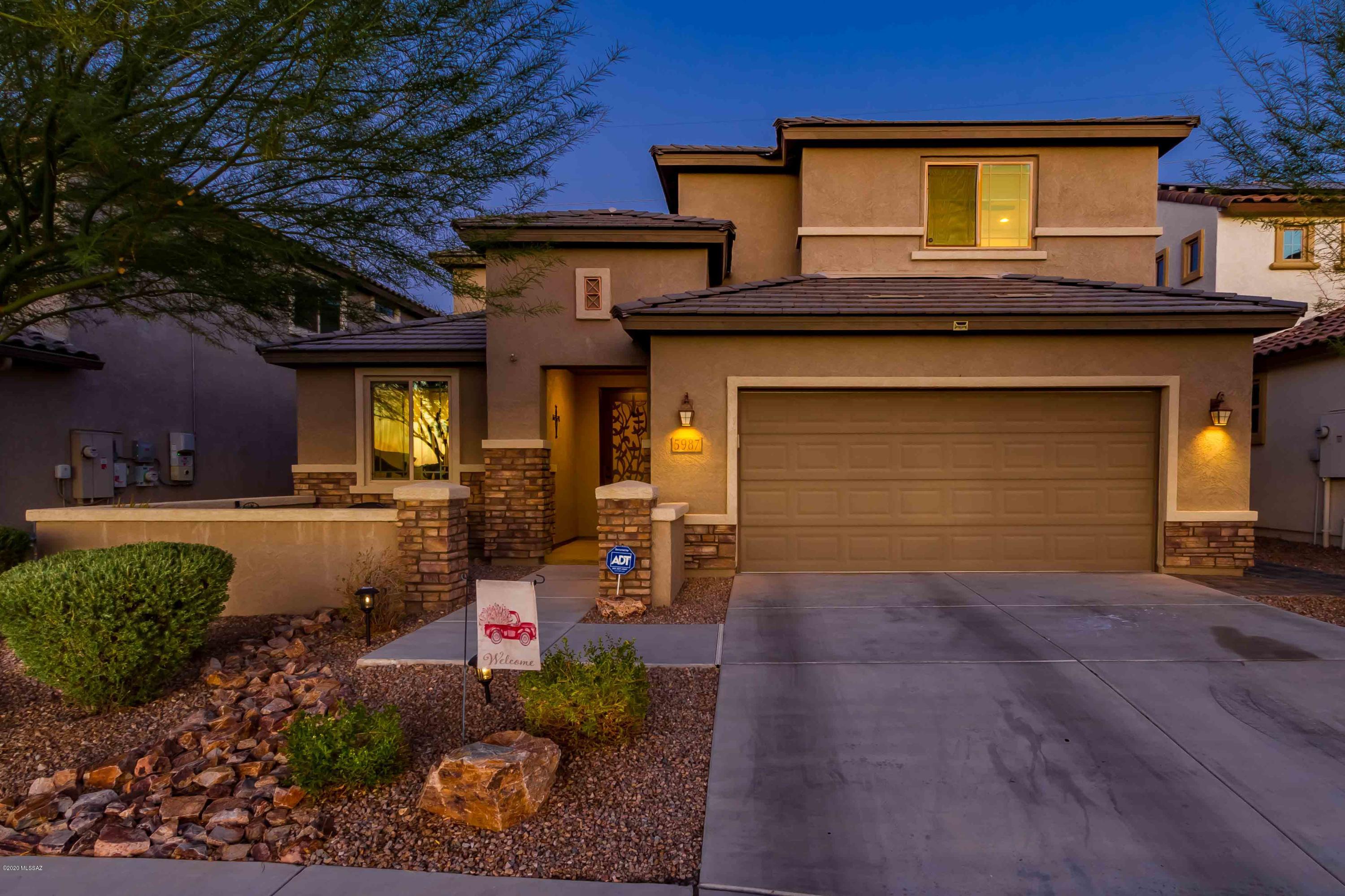 ENTERTAINER'S DREAM HOME!  This 4 bedroom plus den, plus loft in popular Sierra Morado has everything you could imagine & more! Gorgeous open concept great room, kitchen & dining room make gatherings glorious! Designer touches like a custom backsplash, granite counters, 1/8 inch offset tile floors & upgraded fixtures take things to next level. First flr master showcases shower & separate soaking tub, dual vanities & walk in closet. Upstairs, a spacious loft area separates a guest room en suite from 2 addl bedrooms & a full bath. BUT WAIT-The real masterpiece of this beautiful home is the backyard!! Backing to natural desert, this pool & negative edge spa w/ custom lighting & firepit is where the party happens! ALL THIS and showstopping views of the RINCON MOUNTAINS! Welcome Home!