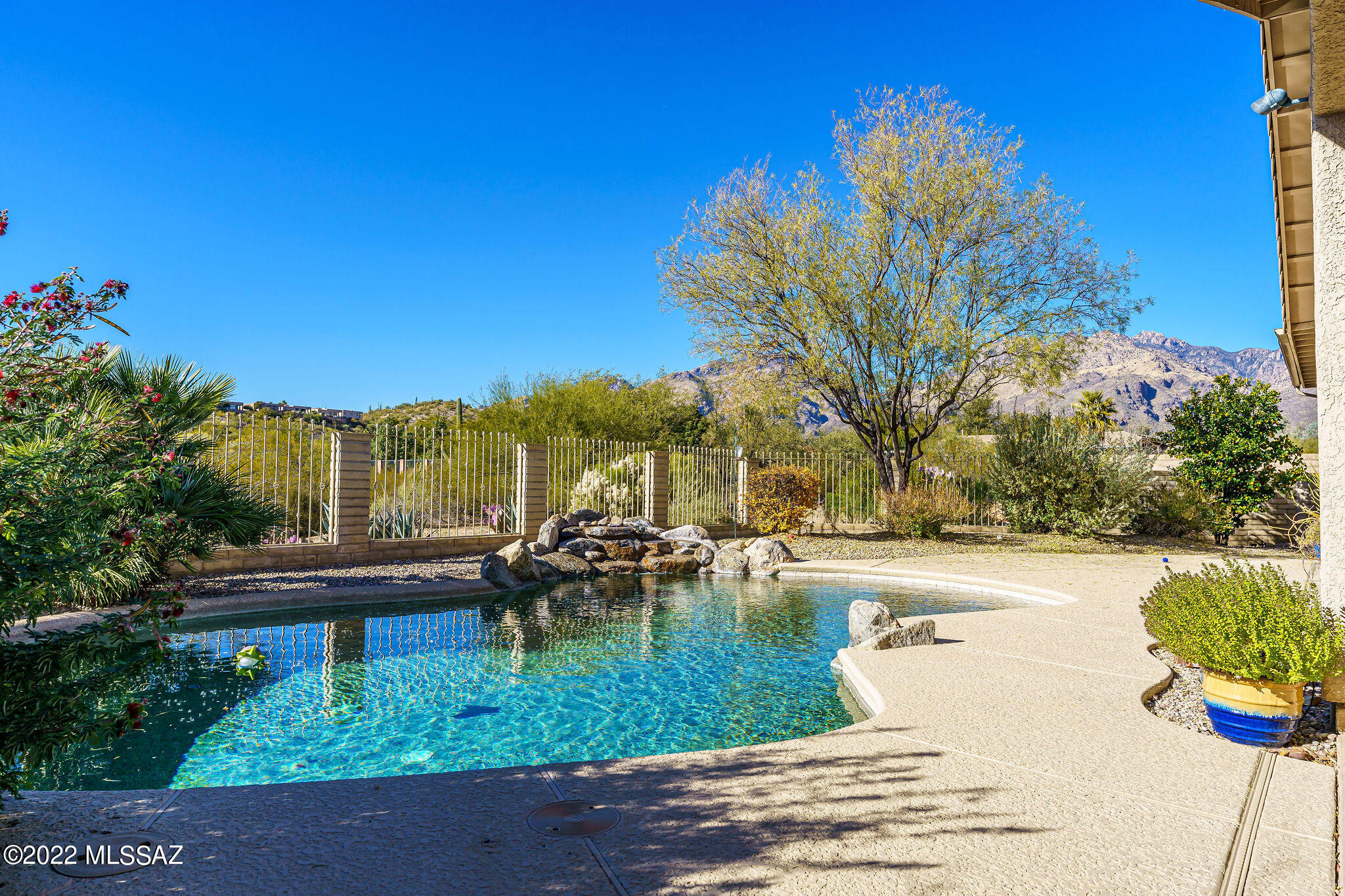 IMAGINE... 4 bedrooms. IMAGINE.an art studio or sewing room with all the storage you need.  IMAGINE Sabino Canyon being close enough for regular hikes.  IMAGINE a beautiful pool with gorgeous views and a covered patio large enough for a crowd.  IMAGINE fruit trees of many varieties with a newer drip system throughout the yard. IMAGINE a fully paid for solar system!  Soft water and a kitchen water filtration system.  Fireplace is beehive shape with electric insert. This lovingly cared for home offers buyers the ability to move in any day and be able to just sit back and enjoy.  This can be your next dream home!  IMAGINING makes things HAPPEN!