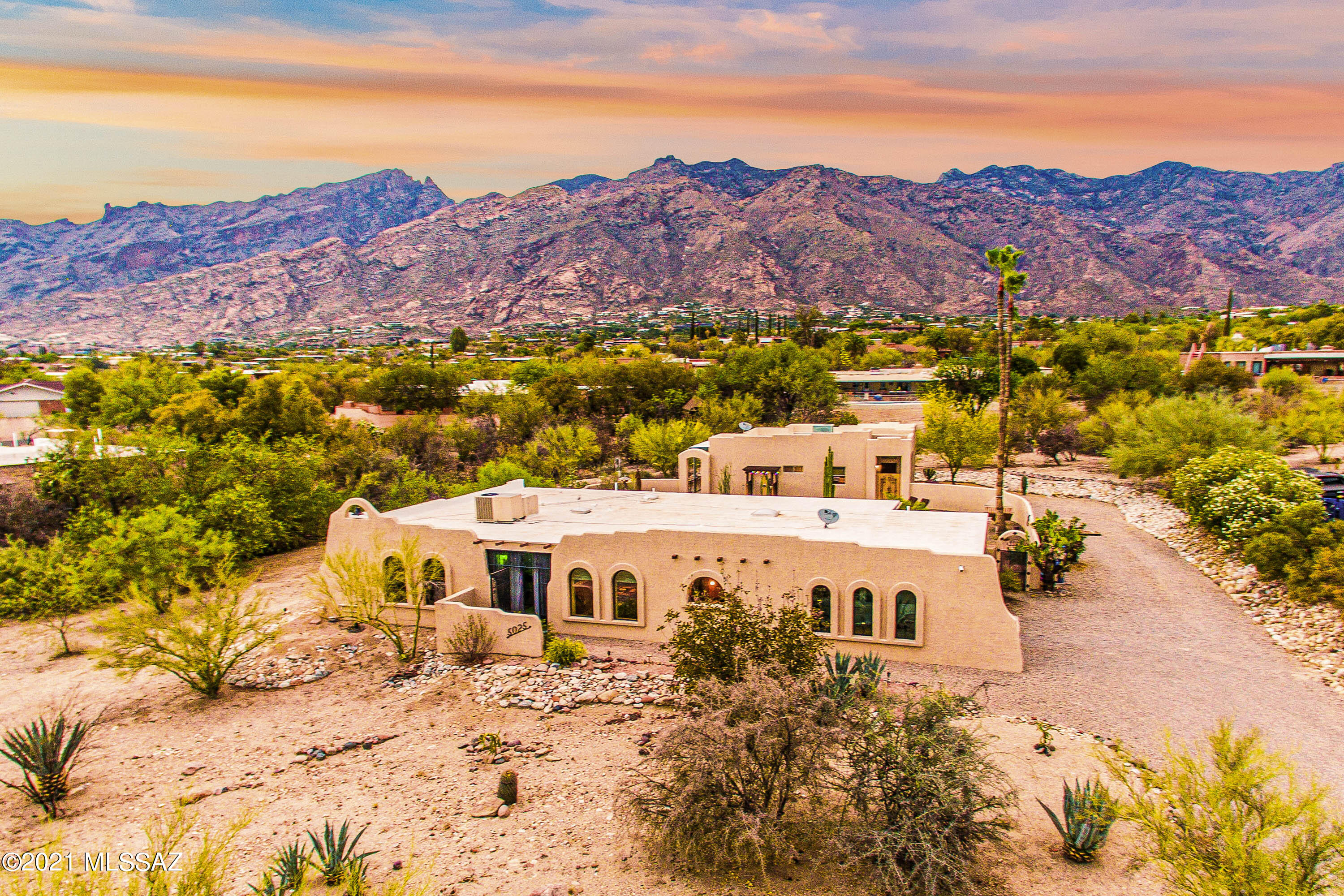 One of a kind Catalina Foothills updated home and newer guest home in Skyline Bel Air Estates! The main home is approximately 1,969 sqft 3 bedroom/ 2 bath. Enter through the solid wood French doors into the welcoming open floor plan. The main living area features exposed beam ceilings, pre wired surround sound, bar area, and newly remodeled kitchen. The gourmet kitchen has a beautiful tile backsplash and is equipped with a SS refrigerator, electric range, microwave, dishwasher, and wine cooler. Step outside to enjoy the panoramic sunset mountain views as you relax poolside. The covered patio has ceiling fans, outdoor sound system, and a 4 year old hot tub. The pool has recently been redone including a new pool deck and multi color pool light. The outdoor shower is located near the fire pit area. The guest house is 957 sqft built in 2009. The guest kitchen offers an electric flat top, microwave, and refrigerator. The guest house has a den area, laundry room, and ensuite bath. The covered enclosed patio has ceiling fans, lighting, and a beautiful art feature. Enjoy endless breathtaking views when you make this your dream home!