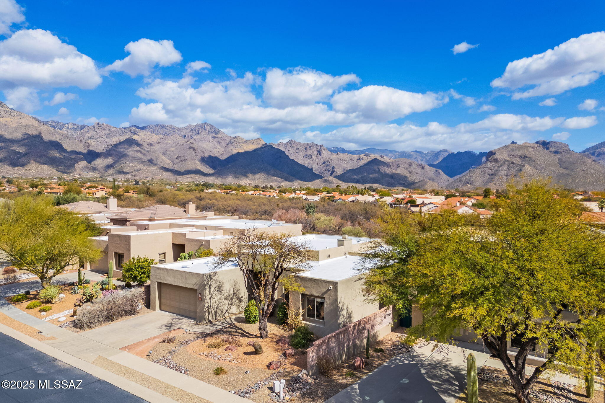 Nestled in the gated & highly sought-after Fairfield built Bonita Ridge neighborhood. Exquisite 2,543 sq ft contemporary home offers the perfect blend of luxury & tranquility. High ceilings & thoughtfully designed built-ins throughout home enhance its expansive 2 bedrooms and 2 & ½ baths. The 3rd 'bedroom' can be office or den & offers amazing flexibility. Large chef's kitchen seamlessly flows into dining & living areas, where a wall of windows frame breathtaking, unobstructed mountain views to the east & surrounding washes. Spacious primary suite features a walk-in closet & a good size second closet + enormous ensuite with separate tub & shower. Step outside to your own private, fully landscaped backyard oasis. Enjoy nature from the large-covered patio, perfect for entertaining or relaxing in total privacy thanks to the surrounding wash. This stunning Foothills home is close to recreation, shopping & dining. District 16 schools. Welcome Home!!