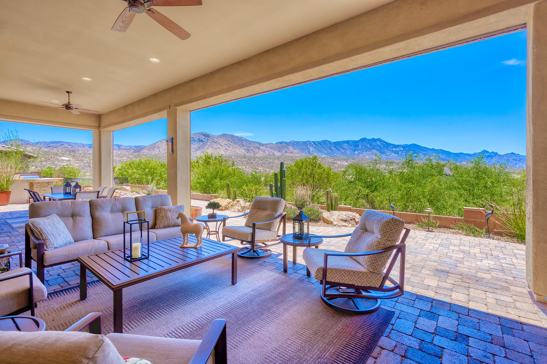 Spectacular golf & mountain views greet you upon entering this beautiful SaddleBrooke Preserve home. Over 3800 sq ft this Sonrisa model is spacious, open & airy & takes full advantage of the views, from the inviting great room's wall of glass, to the open dining room & large island kitchen. Gourmet kitchen has quartz counters, stainless appliances, walk-in pantry & beautiful cabinetry. Owner's retreat has views, en-suite w double vanities, large separate shower, soaking tub, & two walk-in closets. Private guest suite w en-suite, powder room, den, hobby/office, large casita w bath, + 3 car garage completes this home. Enjoy entertaining in the outdoor living room w fireplace, roll down sun screens, spacious dining area, built-in BBQ & expanded paver hardscape with unobstructed views beyond.