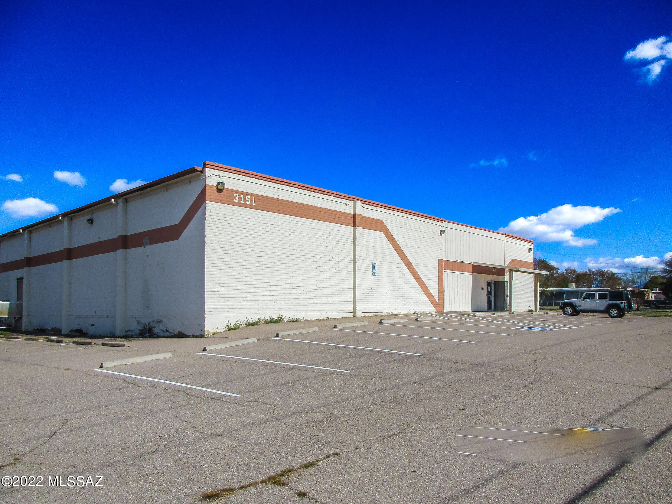 A 29,481 SF Masonry building split into a 19,481 SF back unit and a 10,000 SF front unit. Corner Lot Building on a large fully fenced lot 84,000 SF lot that is zoned MU.  Each warehouse section has 2+ bathrooms and multiple offices.  1200 sqft secured room with a vault door. Multiple Roll-up doors and docking.  The building has 4 electrical meters and plenty of power for anyone with over 1200 Amps. It's located mins from the Tucson airport, I-10, Benson Hwy, Davis Monthan Airforce Base, and a short drive to Downtown.  The Gem Business and Inventory are for sale and the owner will Seller Carry on the building and the inventory.  The owner is flexible on terms and timelines if an Owner/user is interested.   

 Sprinklers - Yes 100%
Loading  - 3 Dock High Doors and 3 ground Level
Power - Heavy 3 phase 1200 Amps.  New LED Lighting throughout
Office - 8 Offices 6 up in the front with HVAC and 2 in the back section.
ADA - ADA Compliant
Ceiling Height - 14' and Column Spacing 40' x 31'
Opp Zone - Located in the Opportunity Zone