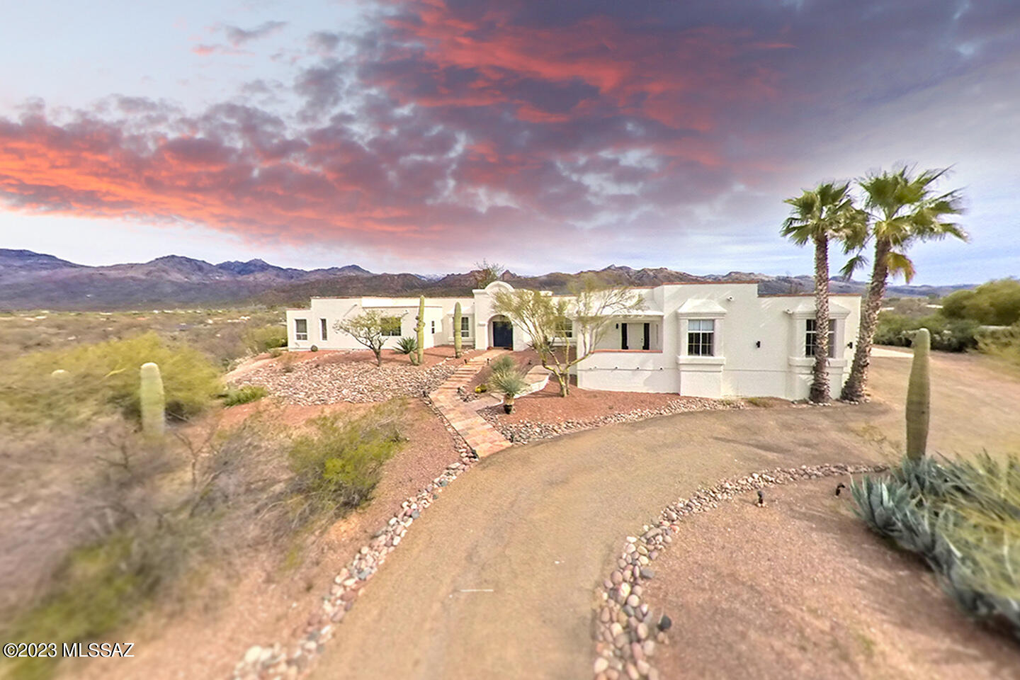 GORGEOUS mountain views from almost every room! This elevated premium lot has no neighbors behind or to the side & also has a desert buffer zone to McDonald Park to the SW. An incredible 3 bedroom multi-generational living space/attached guest house is ideal for an on-site caretaker, visitors, or aging parents who need their own entrance/kitchenette/bathroom. Rather keep the guest house incorporated to the main house? You have a whopping 7 total bedrooms which gives you plenty of options for converting  spaces to home offices/gym/theater. Dont miss the amazing pool with a view! Enjoy the unobstructed, panoramic sunset on the meditation point after spending time in the steam room or Jacuzzi.  Extra Benefit: 2yr old whisper quiet air conditioners for the beautiful Tucson summers Updated flooring, major bathroom upgrades and great polishing touches are evident throughout. Don't forget to check out the permitted sauna room and the sunset meditation path