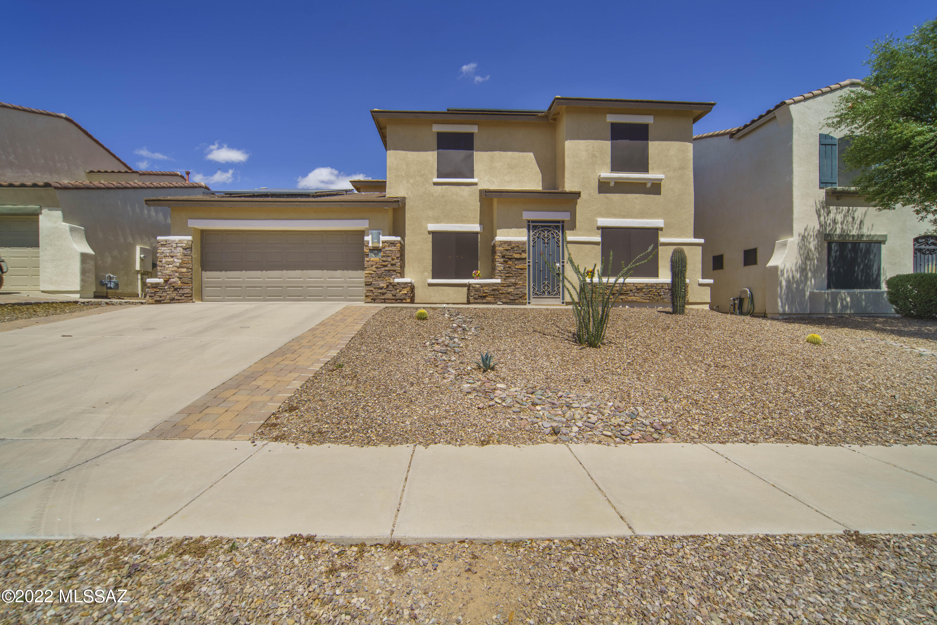 Whether you are looking for a home to relax and unwind after a long day, or a home to entertain friends and family, this beauty has it all! Perfectly located in the heart of the award winning community of Rancho Sahuarita, this home is surrounded by walking trails, parks and the privacy of no direct rear neighbors! The 10ft custom kitchen island and extra storage provides the perfect space for hosting any gathering while the fully screened patio will guide to ultimate relaxation in your peaceful, fully landscaped, backyard... unwind in your steam sauna while the fire crackles and the smell of delicious burgers from your outdoor kitchen ignites your senses.
Enhanced storage, built-ins and custom closet spaces provide ample areas for organizing your home. With an air conditioned three car tandem garage you will find housing for all your cars and/or toys! Two additional flex spaces at the front of the home offer a variety of options, from home office space, gym space, kids play space to homeschool space... the possibilities are endless! This home built by Pulte is complete with leased solar panels to keep those summer cooling costs to a minimum...you truly couldn't ask for more! Welcome Home!!