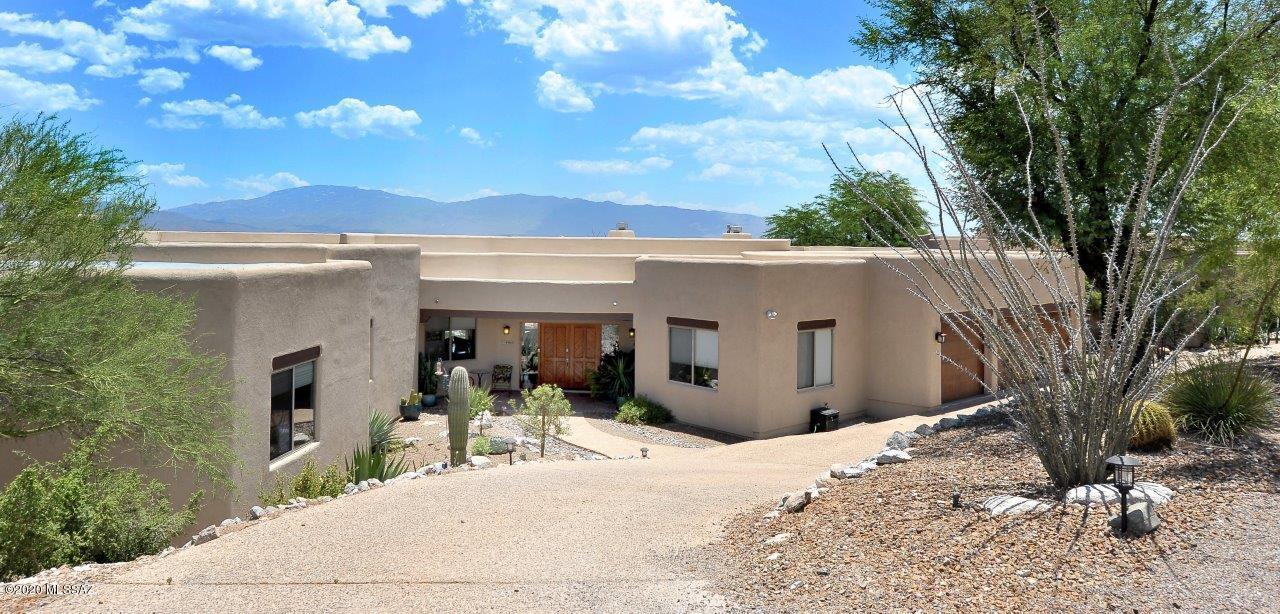 One of the best lots in all of Tucson. Incredible Views View Views of the Santa Catalina Mt's, Rincon Mt's, Tanque Verde Valley & City lights. The kitchen has a 10' foot by 5' granite (Cigneus) countertop with a waterfall edge that can seat 4.
 The stainless steel appliances include top of the line Thermador built in refrigerator freezer, dishwasher, Range and a 37'' induction cook top. Upgraded cabinetry in the kitchen, laundry room and bathrooms. Undermount sink, decorative backsplash. Gas fireplaces in the living and family rooms. Cultured stone from floor to ceiling. Each with 13-14' Granite Hearths. Double sided gas fireplace in the master bedroom and bath. Masterbath includes a Jacuzzi jetted bath tub, large walk in shower with dual heads and controls. Beautiful yard with Lap pool.