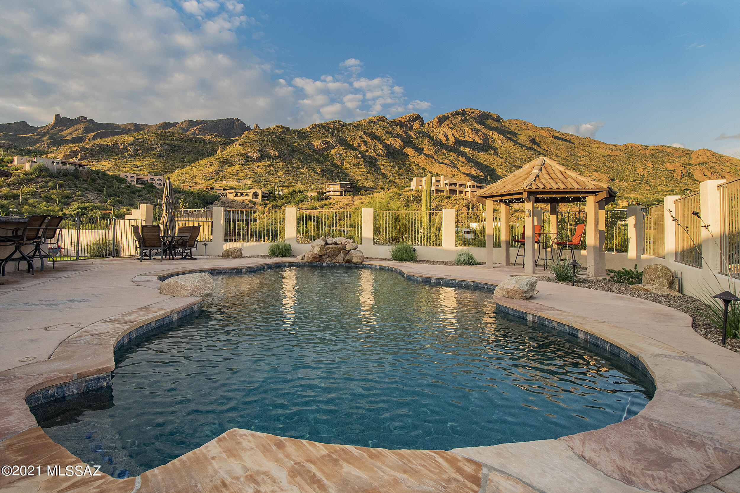 Views! Views! Views! This updated, elevated single-story 4bed/3bath home sits on one of the best lots in Coronado Foothills Estates; abuts 10+ acres of open desert landscape w/ 360 degree unobstructed views of the city, finger rock and 4 mountain ranges. Outdoor entertainer's dream - north/south exposure, new pool, gazebo, built-in bbq/bar, turf backyard w/ putting green, paver courtyard w/ gas fire pit, all new outdoor lighting. Newer HVAC/roof, new flooring/windows throughout; updated kitchen/bathrooms, new stainless appliances; house-wide water filtration system, 100sqft separate office/studio w/ ac/wifi. Cat16 schools and close to amenities. A very special property.