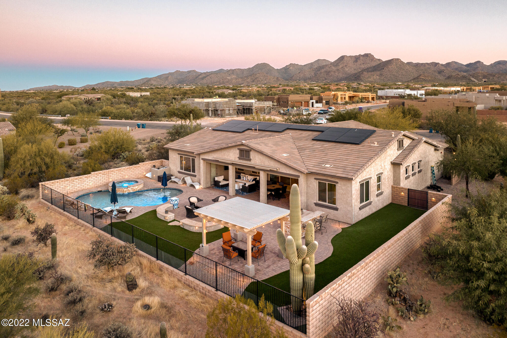 This is the home you've always dreamed about; a picture-perfect showcase of natural beauty in the gated community of Tortolita Vistas. This soft-contemporary beauty was designed to bring the outdoors in, upon entering the home you'll be enveloped in natural light, floor to ceiling windows overlooking the resort style back yard, sparkling pebble-tec pool with raised spa spillway, and gorgeous mountain views. Beautifully appointed 4 bedroom, 3.5 bath luxury residence with 10' ceiling heights, 9' interiors doors, ceramic tile floors, Den, formal dining & living rooms, great room with 10' high-end sliding door system adjoins spacious kitchen. Kitchen color palette is rich looking, modern with Stainless steel appliances, double ovens, 5-burner gas cooktop, rich dark espresso wood cabinets with under-cabinets to highlight the smart looking glass tile backsplash and granite countertops (Monte Christo) and walk-in pantry. The island lends itself perfectly to hosting large gatherings with additional cabinetry for storage. 

The privacy of the spacious primary bedroom is sure to please, featuring an expansive walk-in shower, large soaking tub and gorgeous granite slab double vanities. Looking for Casita or second master suite? The lovely flexible floor-plan offers this option and includes a full bath, walk in closet and separate entrance from front entry. The other bedrooms share a jack-n-jill bath. The house perfectly frames the views from the entire backyard, which features two verandas to relax and entertain near the fire pit, outdoor BBQ grill, wrought iron view fence and professional landscaping. The 3 car-garage is accented by designer garage doors, epoxy flooring, Tesla solar power, NEMA 14-50 plug level 2 charger, and cobalt cabinets. Enjoy unobstructed, expansive views from this luxury residence located on a large .75 acre lot at the end of a long paved driveway. Witness how the mountains change color as the sun sets and night descends, and it can be yours to enjoy every day and every night.

**All information herein is deemed reliable but is not guaranteed. Buyer is responsible to verify square feet, to buyers own satisfaction**