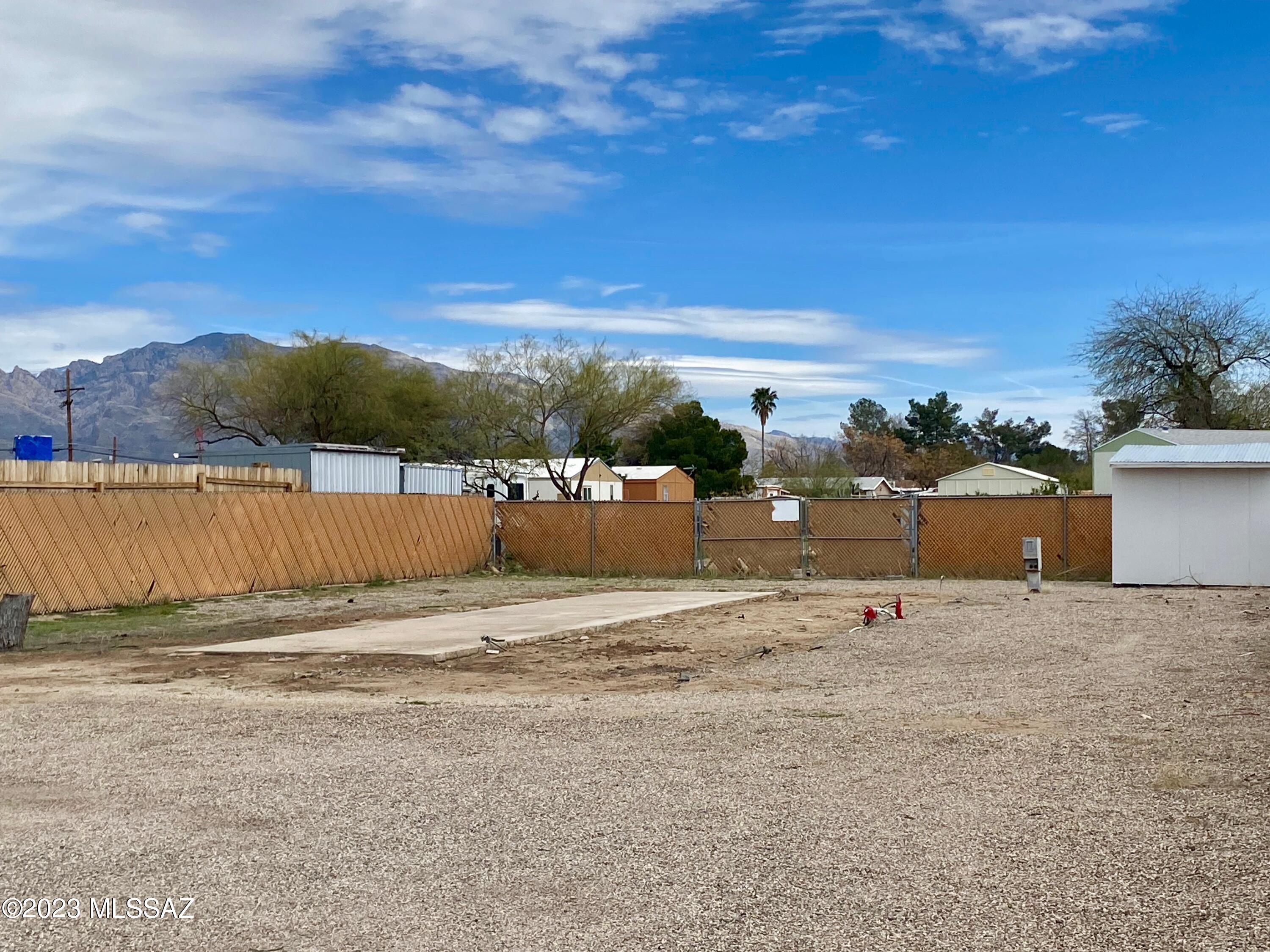 Flat lot completely fenced and ready for your new construction loan or manufactured home. All utilities on site. Sturdy 2 car covered parking structure and storage shed on lot. Enjoy Beautiful Catalina mountain views. Located within minutes to I-10 freeway. Near shopping, Tucson Mall, transportation & popular recreational sites Sporting Chance Sports Center, Rillito River walk, Curtis Park, Flowing Wells Park. Located across the street from the attractive New Habitat for Humanity CHUCK Center building. Previous mobile home has been removed with pad and all utilities on lot.
Great opportunity for investors or homeowners. Within the Pima County Community Development Block Grant Target Area and Tucson Pima Enterprise Zone.