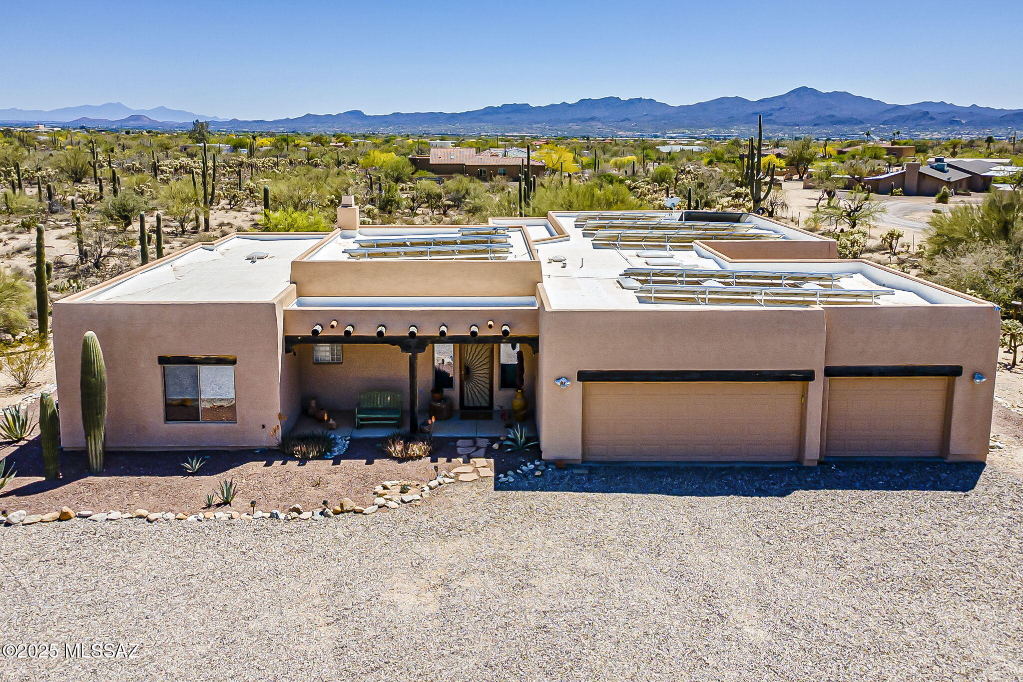Custom Sante Fe-Style Retreat on 3.31 Acres with Mountain Views. Welcome to your private desert sanctuary! Nestled on 3.31 sprawling acres, this beautifully maintained Santa Fe-style home offers serene living with captivating mountain views and southwestern charm throughout. Step inside to discover a desirable split level floor plan, perfect for privacy and functionality. The inviting living space features a cozy bee hive fireplace, ideal for cool desert evenings, opens up to a wood-beamed back patio-a perfect spot to unwind or entertain while taking in the stunning vistas. Enjoy peace of mind and energy savings with owned solar panels, a new A/C installed in 2023, and a flat roof re-coated in 2022. The home's exterior freshly painted 2020, adding to its well-kept appeal. A long private driveway with brand-new gravel welcomes you home, offering seclusion and a grand entrance. With authentic finishes and thoughtful upgrades, this home truly blends comfort, efficiency, and timeless desert style. Don't miss your chance to own this desert gem!