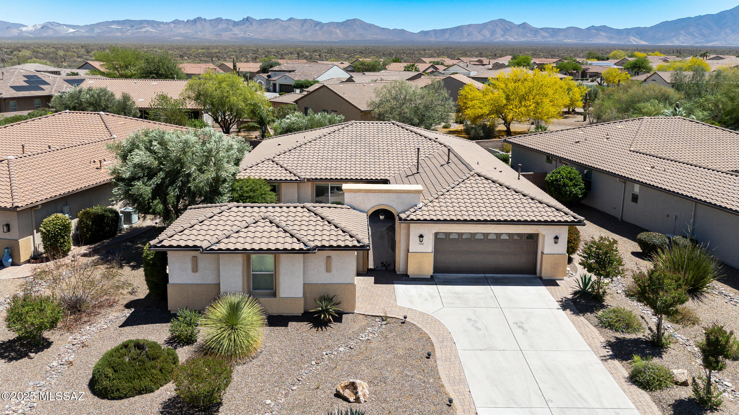 This well-maintained single-story home combines practical design with stylish comfort.  The Great Rm has tray ceilings & flows into a dining area & kitchen, making it ideal for both everyday living & entertaining.  Other touches include plantation shutters, wide hallways, & tile flooring throughout for easy maintenance.  Nestled in a scenic neighborhood with desert views & nearby mountain ranges, you're just minutes from local walking trails, golf courses, & community centers. Grab groceries at Safeway or enjoy a meal at favorites like Manuel's Mexican Restaurant & Ragazzi Italian. Shopping, medical care, & leisure are all a short drive away.The covered patio & desert landscaping invite you to unwind outside with minimal upkeep,
