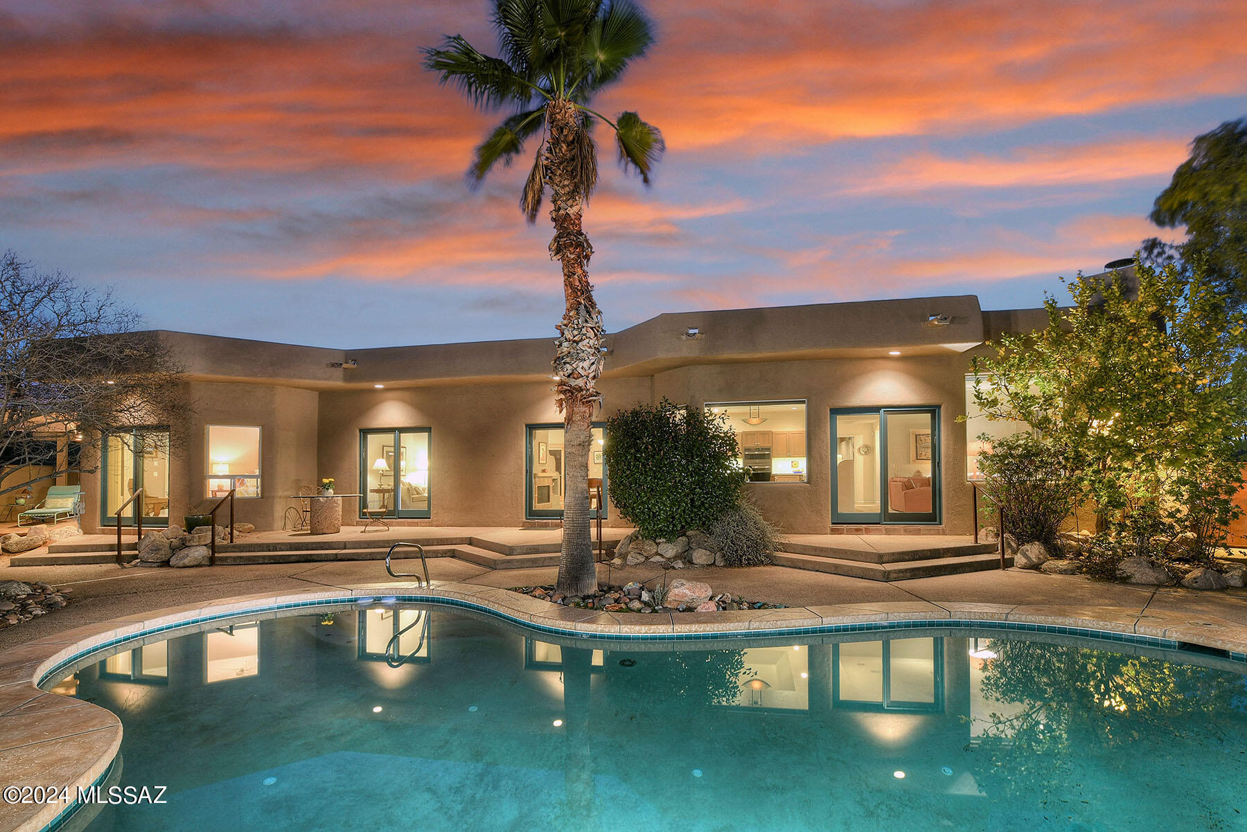 Stunning soft contemporary on secluded 1 Acre w/majestic mtn. views in desirable Catalina Foothills Estates #7. Charming front gated & lush landscaped courtyard, exquisite living rm with high ceilings, 2 way fireplace, formal dining rm, beautifully remodeled gourmet island kitchen w/light Alder cabinets ,quartz countertops, slate gray stainless steel appliances including gas cooktop, lovely breakfast area, tile floors, family rm w/fireplace, 4 sets of Sierra Pacific aluminum clad sliding doors, 3 bdrms (split plan), plus study, 3 baths w/Talavera countertops, Master w/walk in closet & entry to the rear patio, laundry rm w/storage, washer & dryer, oversized & extended length 2 car garage w/ sink. Enjoy fabulous bkyd w/ covered ramada, gas heated pool, spa, mature fruit trees & mtn. views!