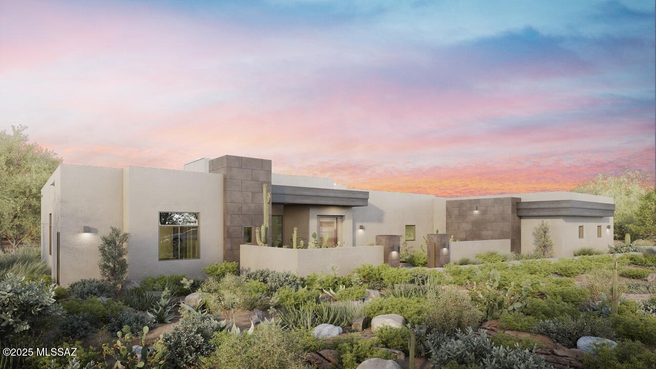 Under Construction | Experience the epitome of luxury living on Stone Canyon's coveted Hole #10—arguably the best golf hole lot in the community. With sweeping views of the entire fairway, the Tortolita Mountains as a dramatic backdrop, and a sparkling lake in a serene park-like setting, this home offers unmatched privacy on one of the most desirable streets in Stone Canyon.

This 4-bedroom, 4.5-bath contemporary home is designed to impress at every turn. A grand entry opens to soaring 15-foot ceilings accented with tongue-and-groove detail and an illuminated tray. The expansive great room, anchored by a dramatic fireplace, flows seamlessly into an opulent kitchen showcasing rich quartered walnut cabinetry, a Wolf range with custom wood-wrapped hood, a Wolf built-in coffee system, and two Cove dishwashers for effortless entertaining. The oversized island, measuring an impressive 6 by 10 feet, is finished in seamless Paramount quartzite and serves as a stunning centerpiece. The kitchen wall will be fully integrated with custom cabinetry for a clean, streamlined look, while a Sub-Zero 24-inch wine tower with 102-bottle capacity stands in-between  the 30"  Sub-Zero refrigerator and freezer for a an impressive design feature. 

A fully outfitted butler's pantry extends the home's culinary excellence with custom shelving and cabinetry, a second sink, a 30" Sub-Zero see-through refrigerator, and abundant storage for both function and elegance. The home also features a full bar with beverage center and ice maker, perfect for effortless entertaining.

Indoor and outdoor living harmonize beautifully with an oversized rear covered deck and yard complete with pool, spa and lush vegetation, A Wolf outdoor BBQ, fire pit and often visiting wildlife.   The primary suite offering an oversized bedroom, spa-inspired bath, its own fireplace, and a lavish custom closet. Every detail has been curated for the most discerning buyer. Completion is anticipated for late April 2026, presenting an opportunity to secure a beautiful custom home in Stone Canyon's most extraordinary setting.