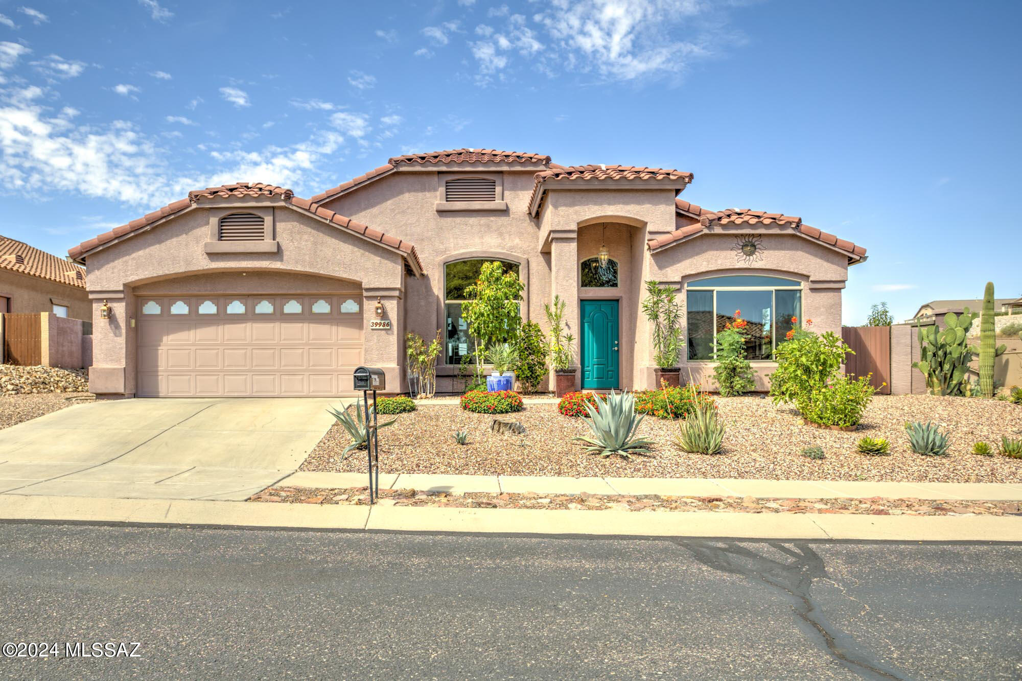 One of the best offerings in Eagle Crest Ranch, this impeccably kept home on an elevated corner lot has beauty, privacy, and seamless indoor-outdoor living. Large family/great room leads to an intimate patio with outdoor seating and dining—also a distinctively beautiful heated Pebble Tec pool, complete with lagoon and travertine-style surround seen in luxury homes. Front, back, and side yards have been a gardener's oasis and are perfect as they are, or are ready for a new homeowner's touch. Split bedroom plan. Spacious primary suite with large walk-in shower, dual vanity, and exceptional closet. Separate living room and formal dining are on each side of a welcoming foyer. Wonderfully appointed kitchen, central in the home, has a gas range, center island, breakfast bar, and both a walk-in and butler's pantry. Ten minutes to Oro Valley Marketplace for shopping, dining, and entertainment. Hiking, picnics, day trips, and camping are minutes from home with close by with Catalina State Park to the south and Oracle State Park to the north. Come for a visit. You'll want to call this 'home'!