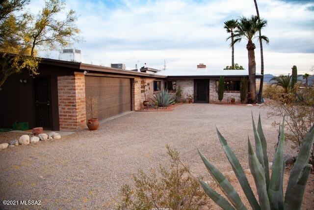 Mid  Century charmer with beautiful exposed wood ceilings, three sided  fireplace,  huge windows everywhere!   Enjoy the incredible sunsets from the covered patio over looking the pool while cooking out on  the built-in BBQ and enjoy  the mountain views in  all
directions.  Quaint vintage kitchen with so much character. Main home has  3 bedrooms with 2 baths, tons of storage.  Separate studio apartment has large room with fireplace, private entry,  has kitchenet, storage room or small office and bath. New  HVAC, pool pump  and motor. Freshly painted exterior  with mature landscape. No carpet  and NO HOA.  Average rent for Apartment is $110 per night or $3,000 per month.