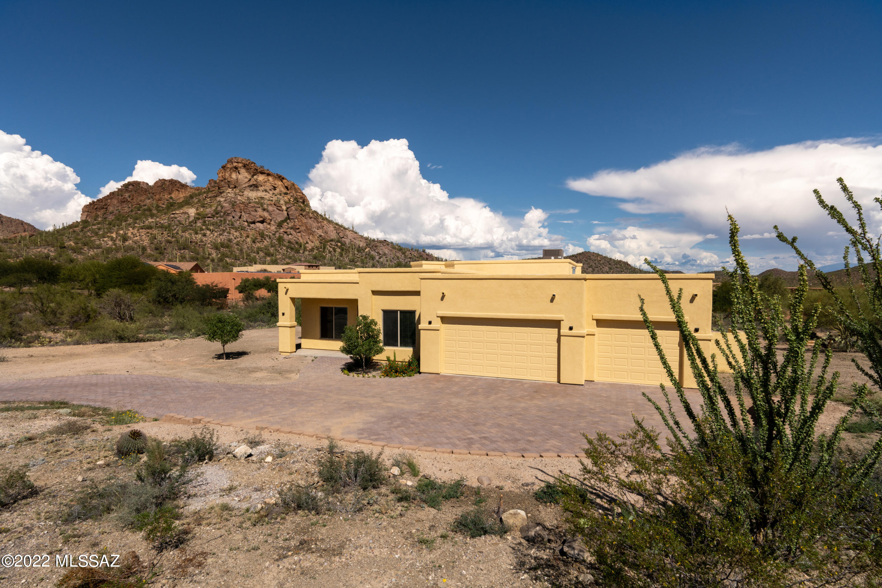 Beautiful gem of a house, with 4 bedrooms and 3 bathrooms, sits on a large lot with great views.  Inside you will find a tile throughout, living room and dining room with 12-foot ceilings.  The rest of the house has 10-foot ceilings.  Kitchen granite counter tops and stainless-steel appliances.  Bathrooms have granite, dual sinks in master and guest bathroom.  You also get a large rear patio running the length of the back of the house.  Enjoy your mountain views and the incredible Arizona weather.  Don't hesitate, make your move.