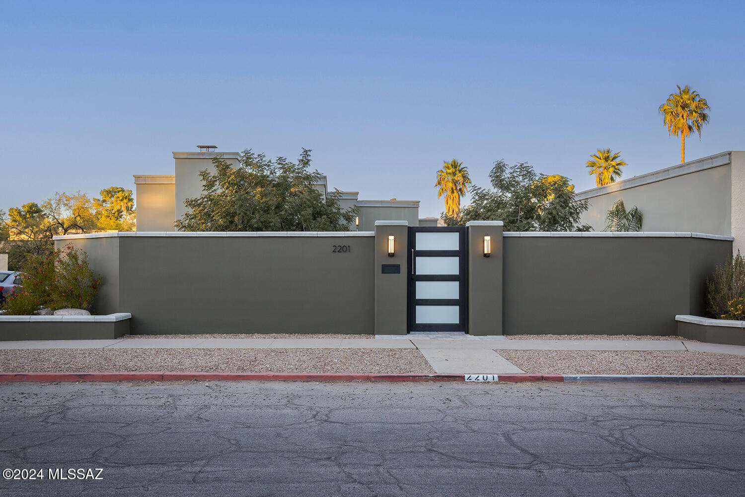 Located in the heart of the Historic Blenman-Elm neighborhood, this contemporary modern home is a masterpiece reimagined by renowned designer-builder Kevin Osborne.  Step into a spacious open-concept living area highlighted by a custom kitchen featuring a spacious island with sleek quartz countertops, premium stainless-steel appliances, and an expansive layout ideal for hosting. Custom finishes, Venetian plaster walls, and porcelain tile floors throughout. Light fills the home with large picture windows, skylights, and glass doors, seamlessly blending indoor and outdoor living. The fully walled-in property gives privacy, and the courtyards are an entertainer's dream, offering elevated patios, raised planters, and travertine pavers. Steps from the Arizona Inn, walk to the Uof A, Banner Hospital and the modern street car to take you downtown with easy access to shopping, dining, and entertainment.
