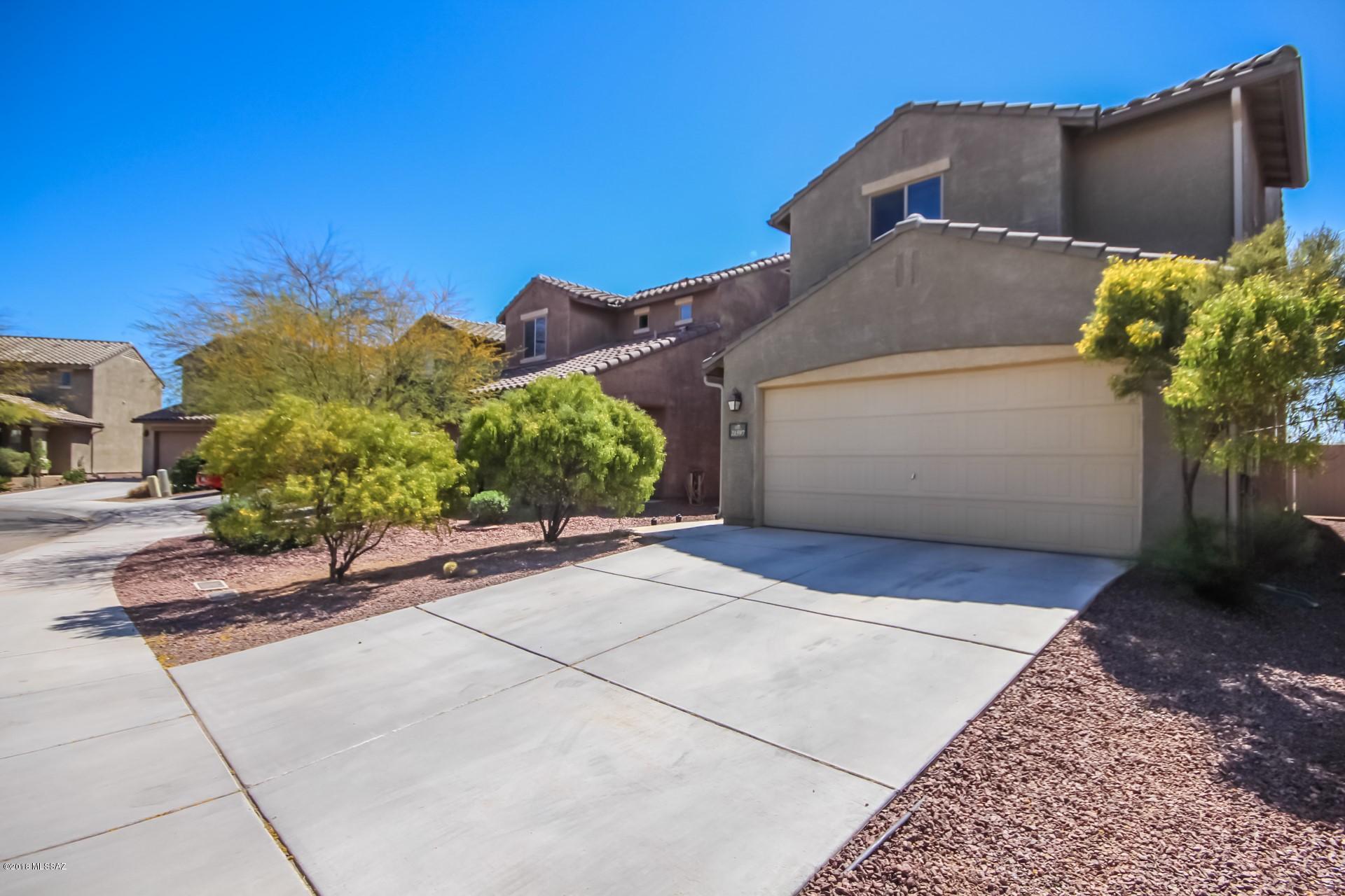 Fantastic move-in ready two level Home with lots of upgrades! Soothing palette, ceiling fans, beautiful wood ''look'' tile floors, window blinds, and spacious open floor plan. Granite kitchen counters, breakfast bar, black appliances, and wood cabinets w/hardware. Patio access from dining area. Loft area with endless possibilities. Generous size bedrooms w/plush carpet, ample closets, and 2.5 baths. Enjoy the backyard paver patio, decorative stone, and room for a pool! Will NOT disappoint!!