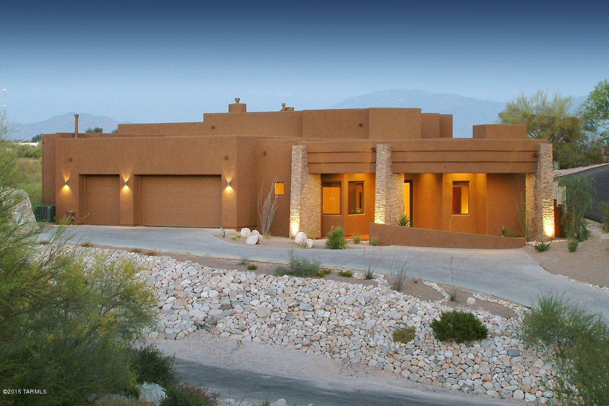 STUNNING SOFT CONTEMPORARY HIGH ON A RIDGE WITH MAJESTIC CITY
& MOUNTAIN VIEWS,OVER 1 ACRE W/ PRIVATE MOTORIZED GATE IN CATALINA FOOTHILLS ESTATES #2,  
CUSTOM DESIGNED GLASS FRONT ENTRY DOOR,EXQUISTE GREATROOM W/HIGH CEILINGS,  DRAMATIC SLATE FIREPLACE,FLOOR TO CEILING WINDOWS,
DINING RM,WET BAR,GOURMET ISLAND KITCHEN W/CUSTOM CABINETS, GRANITE COUNTERTOPS,STAINLESS STEEL APPLIANCES, GAS STOVE TOP,
2 DISHWASHER DRAWERS,REFRIGERATOR, TRAVERTINE TILE FLRS, 8 FT.DRS THROUGHOUT, 4 BEDROOMS, SPLIT PLAN. (EACH W/THEIR OWN BATHS),MSTR SUITE  W/FIREPLACE, LUX BATH W/GRANITE COUNTERTOPS,JACUZZI TUB,DBLE SINKS,SHOWER, LG WALK-IN CLOSET & PRIV ENTRY TO REAR PATIO.
ENJOY  GRACIOUS  OUTDOOR LIVING W/  WRAP AROUND COVERED PATIO W/SLATE FLOORING, BBQ,GRASS & VIEWS! FLR PLN UNDER PHOTOS,VIRTUAL TOUR