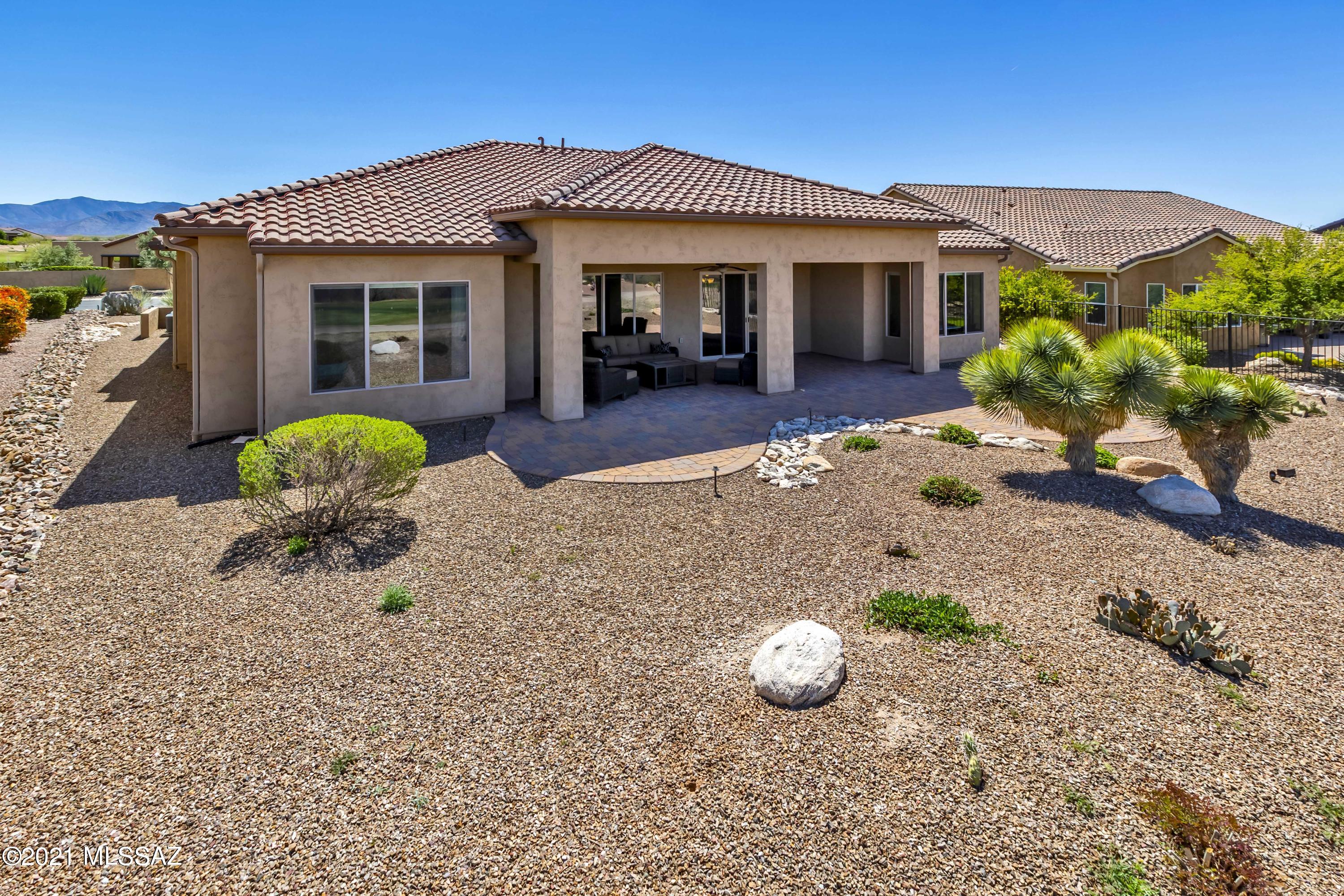 Welcome home to luxury living in this exquisite Brisa model with golf course views. This majestic open floor plan features many special touches including upgraded custom two-tone paint throughout, stained oak cabinetry, ceramic tile flooring and granite kitchen counter tops.Cooking is a chef's delight in the bright open gourmet kitchen that features a generous center island, stainless steel appliances, and a significant amount of storage including a large walk-in pantry.Spacious Owners suite offers a soothing bath with separate tub, walk-in shower, and a spacious closet. The versatile den is perfect for your home office, separate TV room or library. Sit back and enjoy your enchanting backyard that overlooks the 16th golf course green and offers picturesque sunset views. This exquisite home also includes a Casita featuring its own full bath that is sure to offer comfort and privacy for you and your guest(s). This is the home of your dreams!