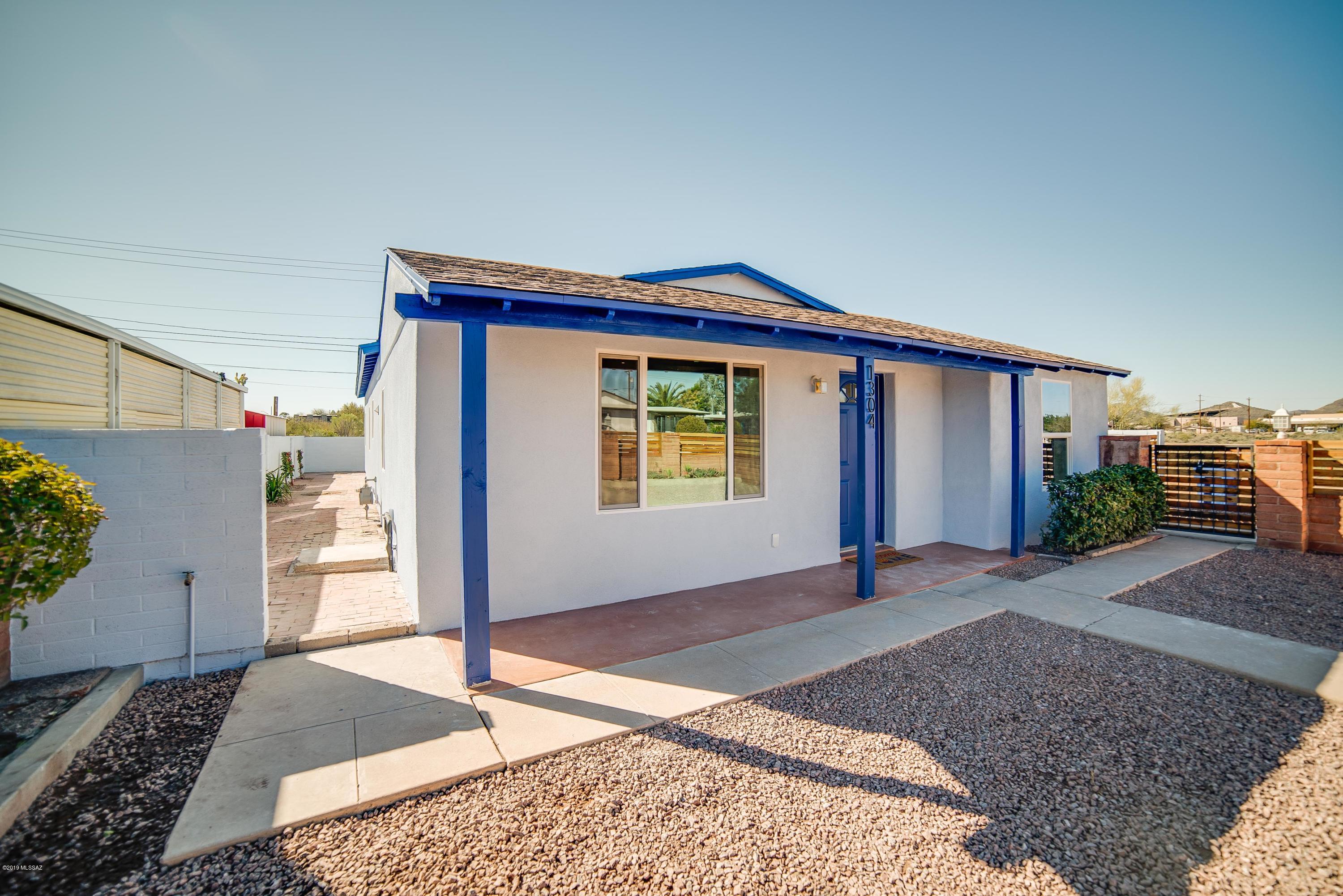 Seller to entertain offers between $375,000 to $400,000. This newly, beautifully remodeled home in Central Tucson is a must see!  Features include 5 spacious bedrooms, 3 immaculate bathrooms, and open kitchen with a large island and stainless steel appliances.  The home is very private with a gated driveway and fenced-in front yard.  Master bedroom has a beautiful bathroom and large, walk in closet.  The open living room and large yard make this home perfect for inside or outside entertaining.  New items in the home include: all utilities, new flooring, paint, doors, cabinets, appliances and over 1000 added square feet.
