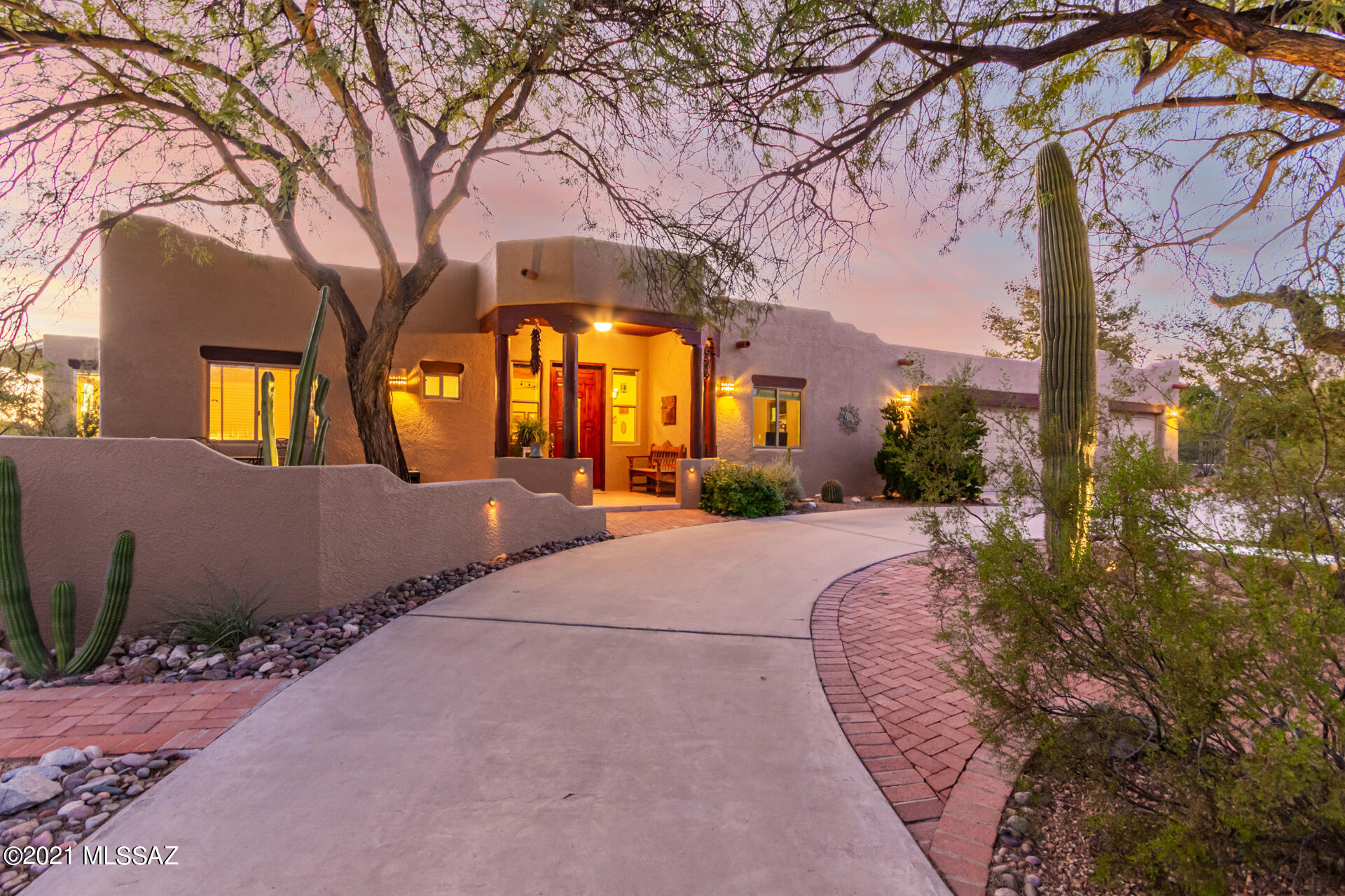 Luxurious home in the desirable and exclusive neighborhood of Sneller Hills. Minutes from Catalina Hwy and Mt Lemmon; residents have easy access to year-round outdoor activities. Families of any size will have plenty of room in this spacious five bedroom home and will love the short drive to Tanque Verde Schools. The living area continues outdoors into the back yard with an extended paver patio enclosed by five electric rolling shades.  Entertain groups of any size in any season with the built-in commercial grade grill, fire-pit, and luxurious spa waterfalling directly into the pool. For more tranquil evenings, relax at the rooftop sitting area and take in the panoramic views of the Catalina Mountains and Tucson city lights. Solar panels are owned resulting in extremely low electric bills. On days when the Tucson heat is just too much, residents can stay active indoors in the gym/game room shaded by solar awnings. The property conveys with seller owned solar systems that keep electric bills low--around ten dollars per month on average.